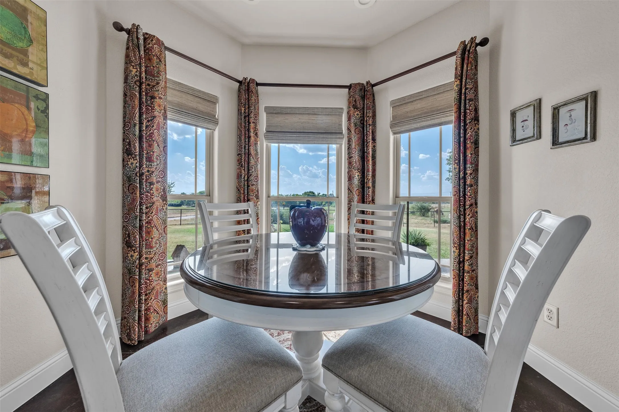 Bay window with multiple vertical windows, recessed lighting, and dark wood-finish flooring