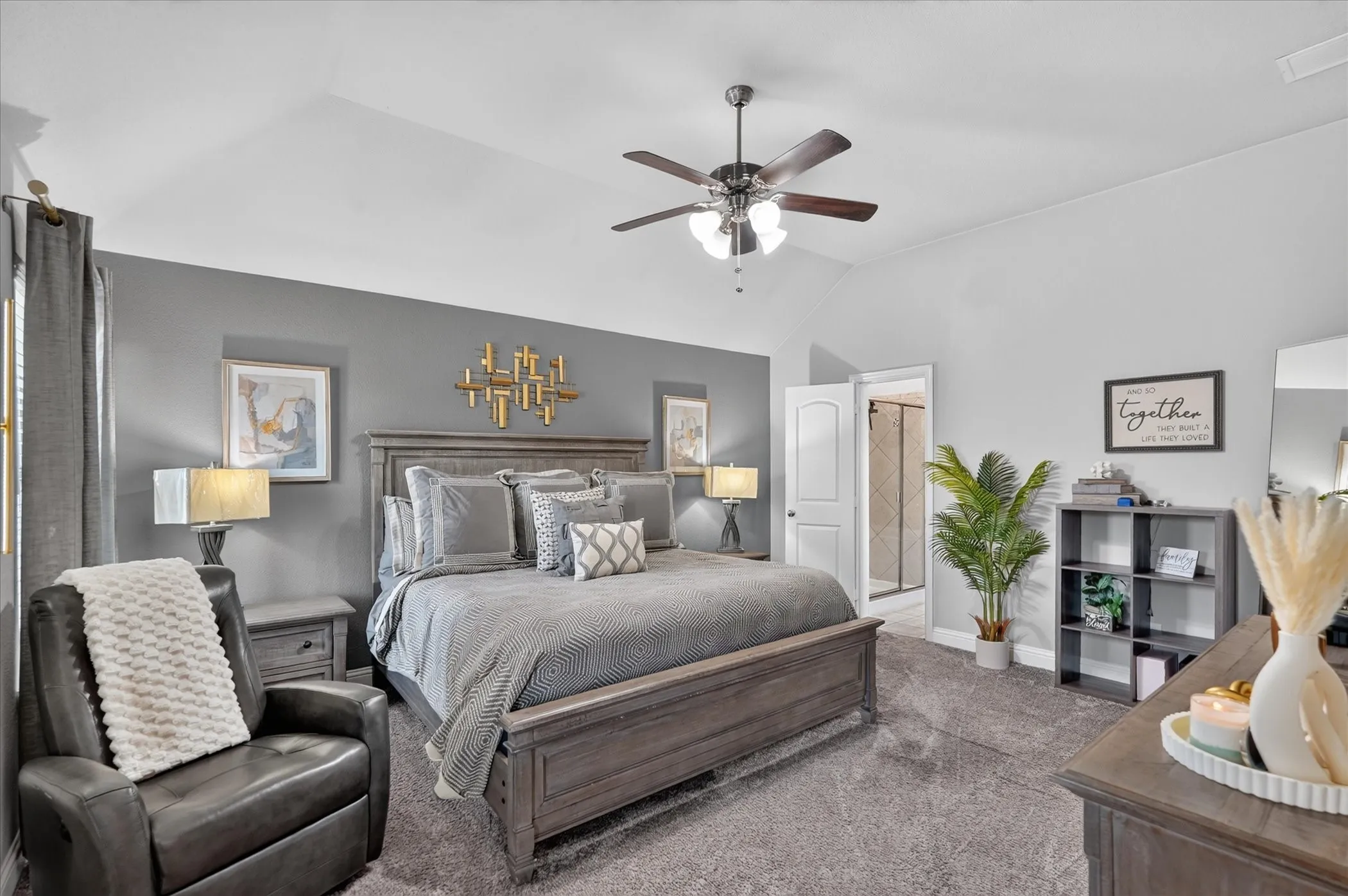 Vaulted ceiling with a ceiling fan, recessed lighting, and soft gray carpeting