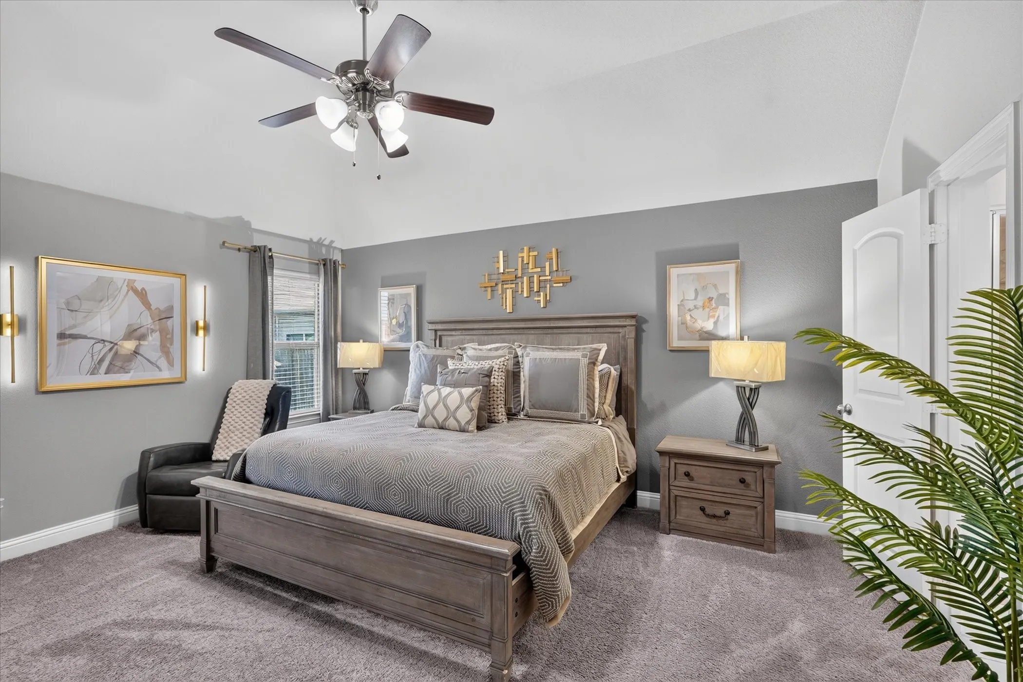 Vaulted ceiling with a ceiling fan, carpeted flooring, window with blinds, and white interior doors