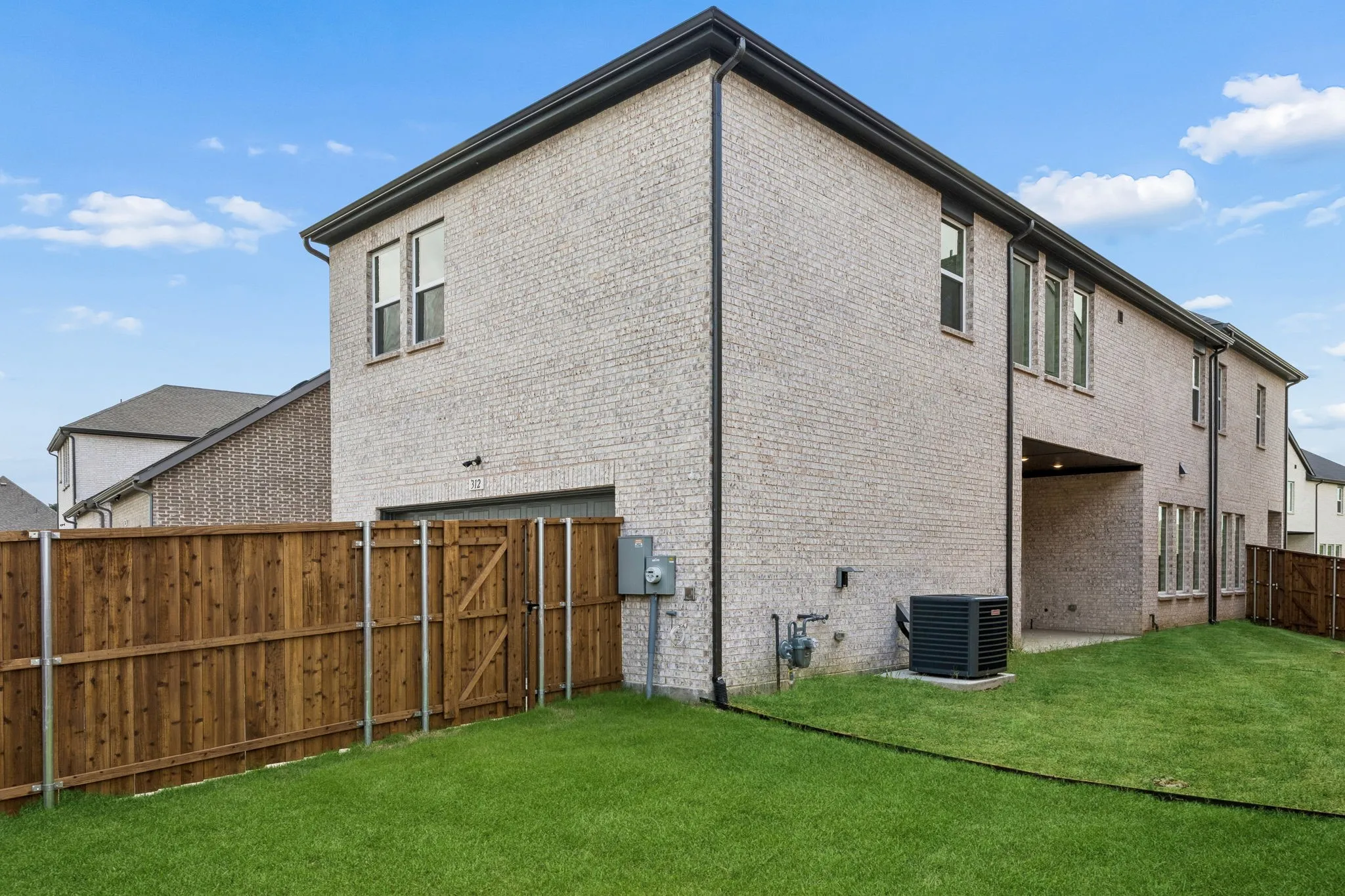 Plenty of outdoor family fun time to be had in this wonderful fenced yard with covered patio!