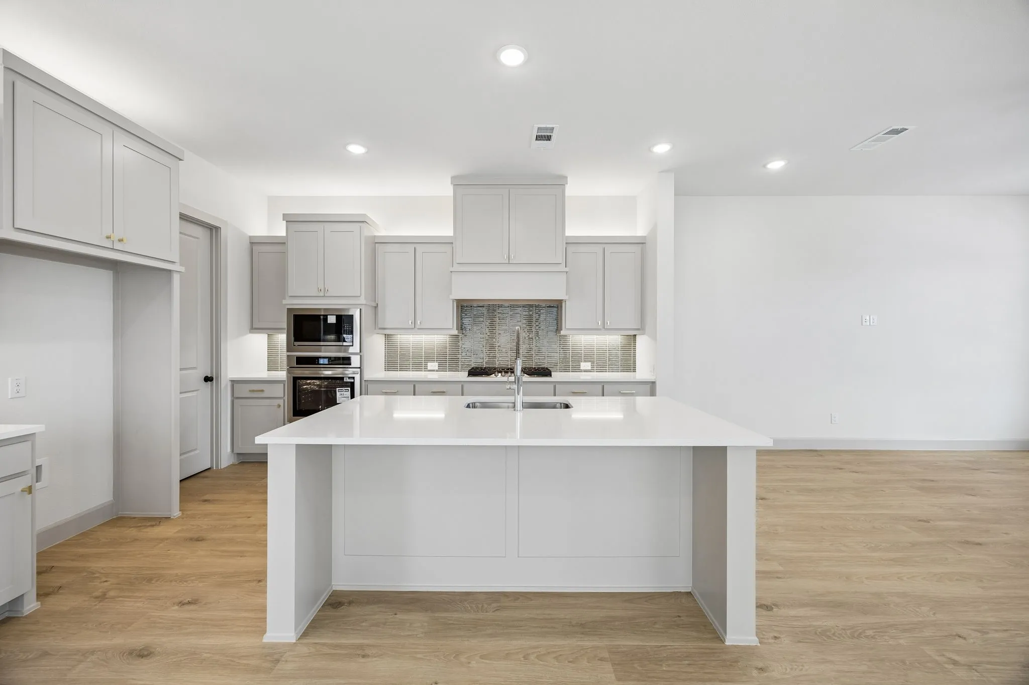 Your fantastic new kitchen features an oversized island perfect for friends and family to gather round!