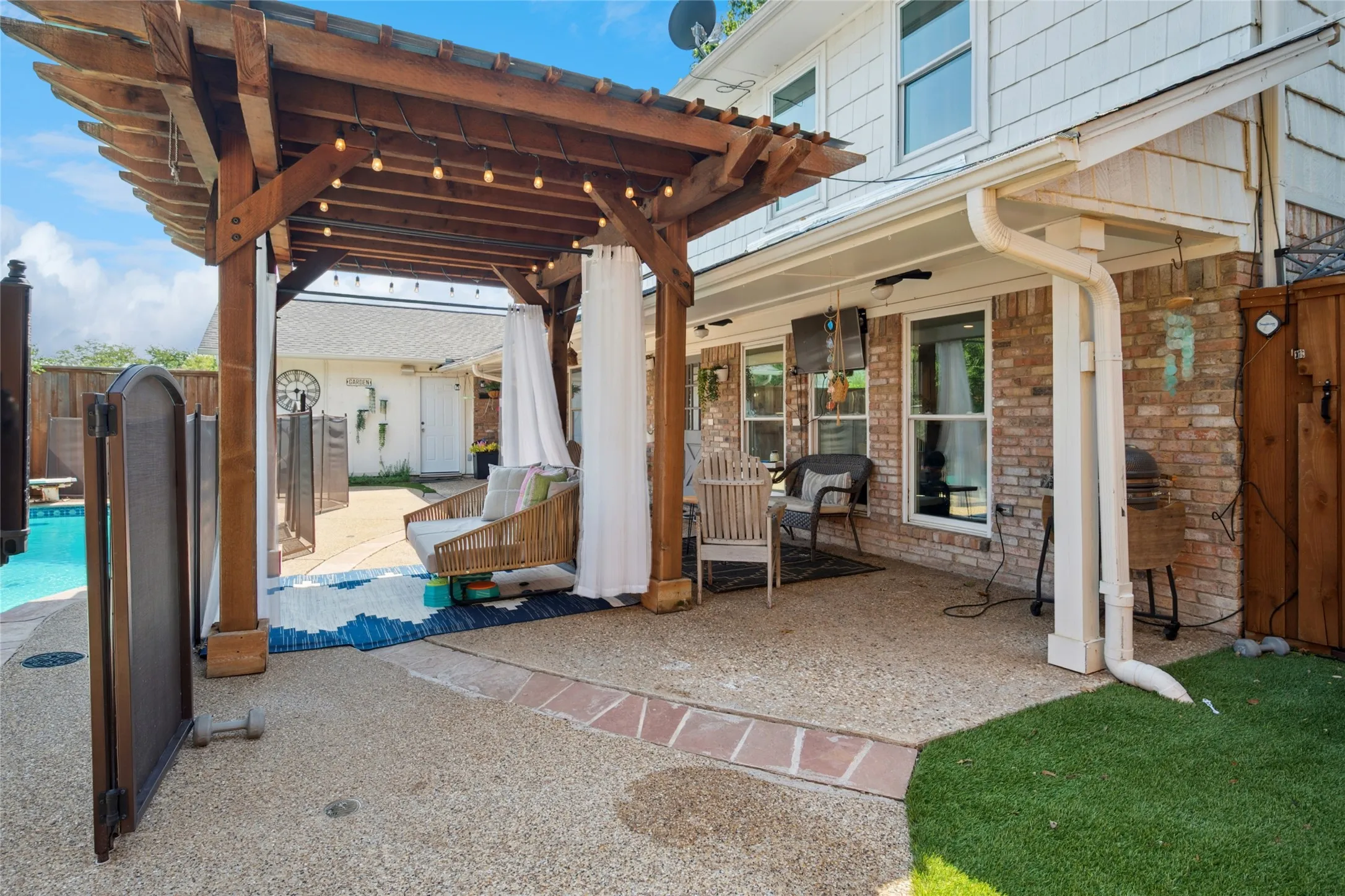 The shaded patio offers an inviting place to relax and entertain.
