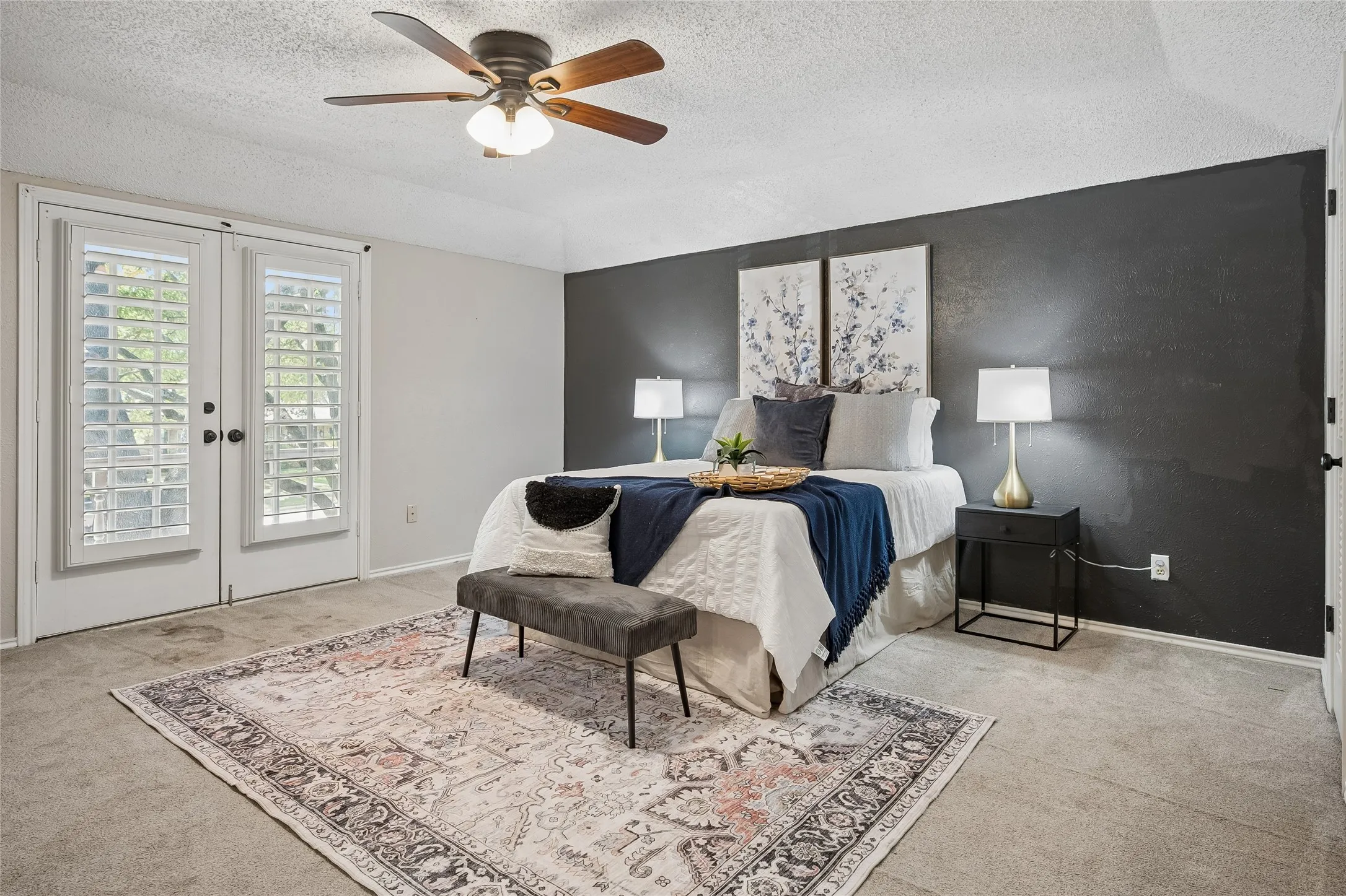 The spacious primary suite opens to a balcony.