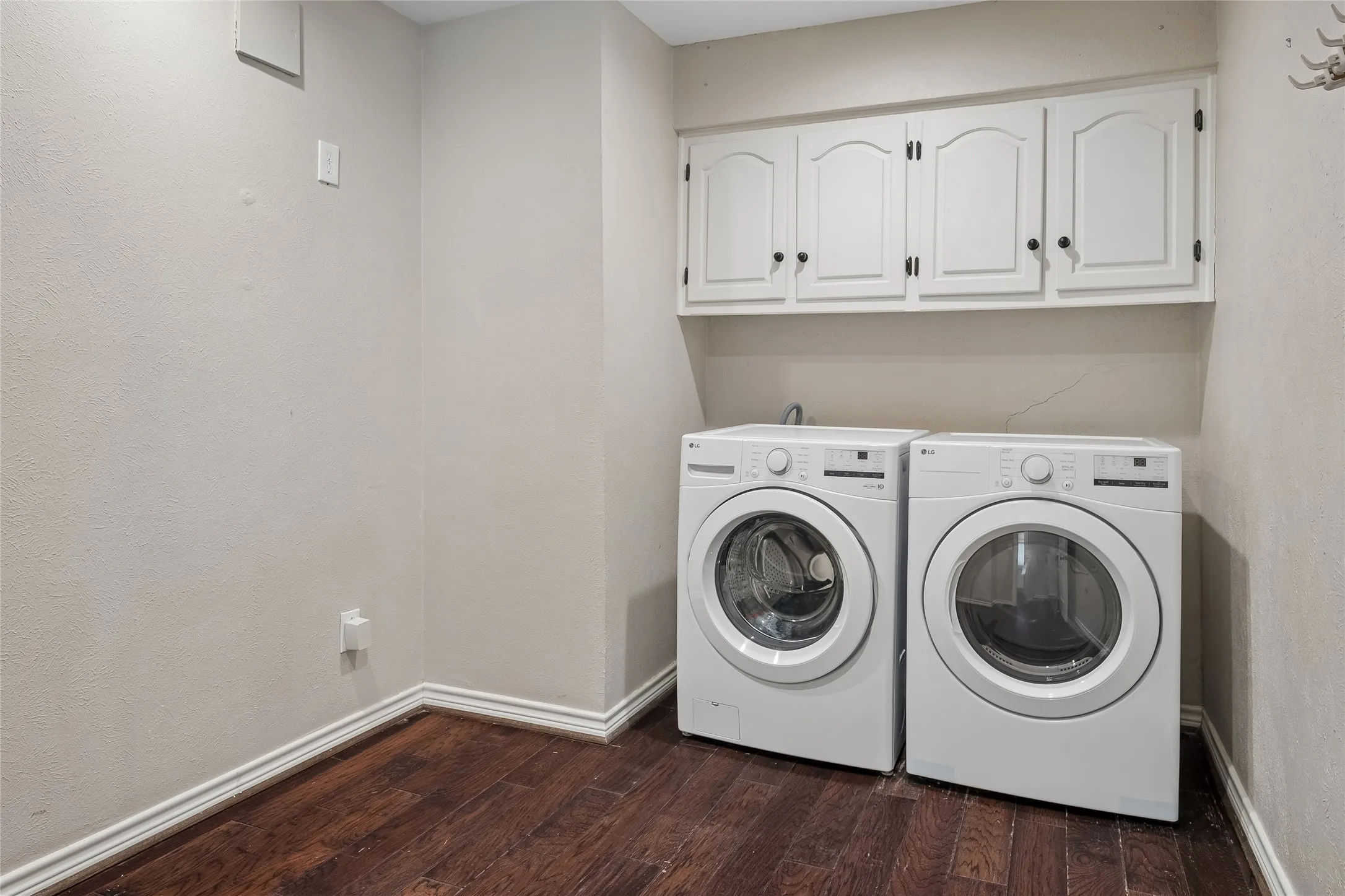 The oversized laundry room has plenty of space for storage.