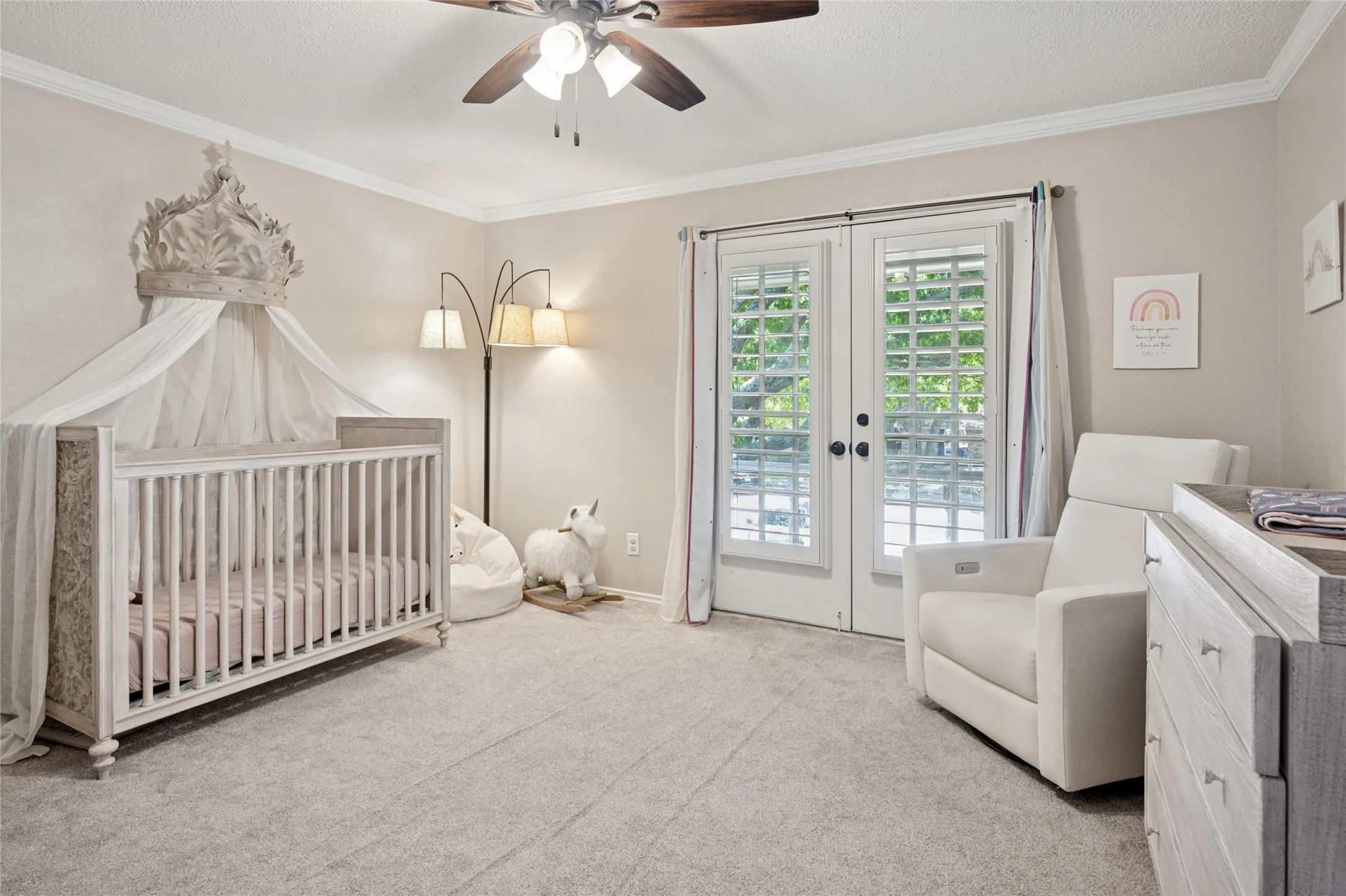 Bedroom featuring French doors opening to the front balcony