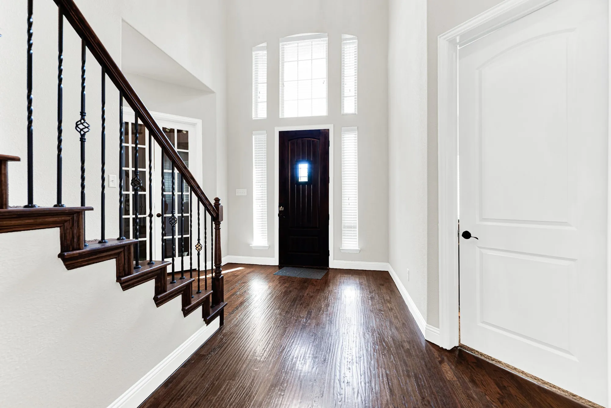 A grand entryway featuring tall transom windows over the front door creates a bright, soaring welcome. Imagine stepping through the door after a long day and instantly feeling right at home.
