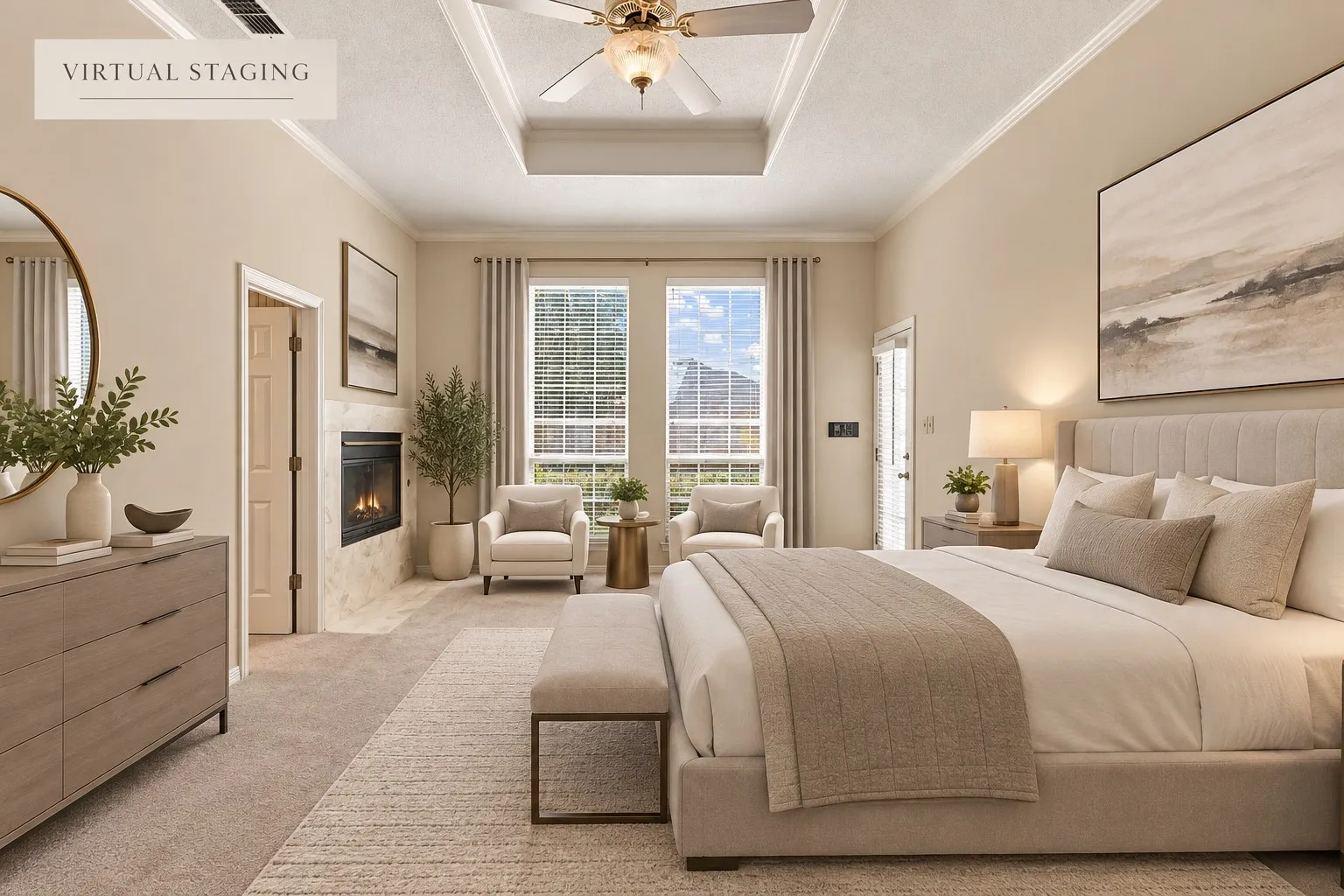 Recessed tray ceiling with crown molding, ceiling fan with integrated lighting, wall-mounted fireplace with stone surround, two double-hung windows with blinds, and paneled interior doors