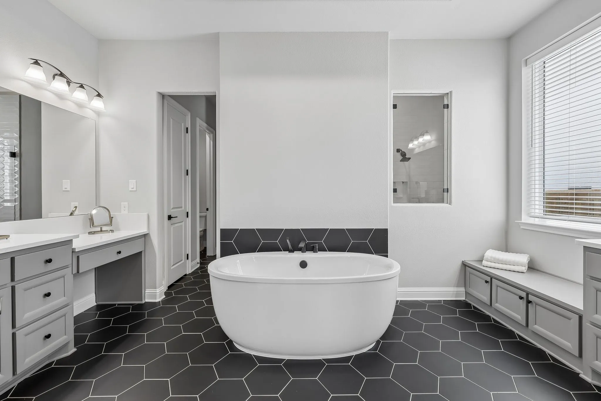 Features include 2 separate closets, tub, upgraded shower and separate vanities