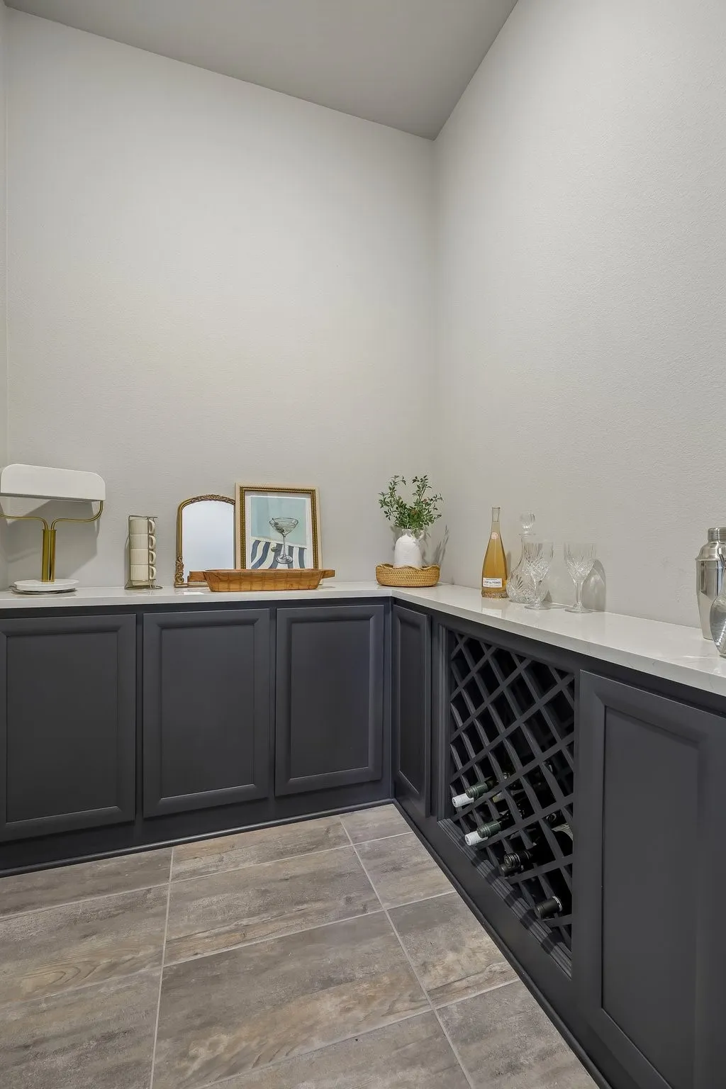 Wine cellar off entry - enclosed with a grand, modern and sleek door with glass panels