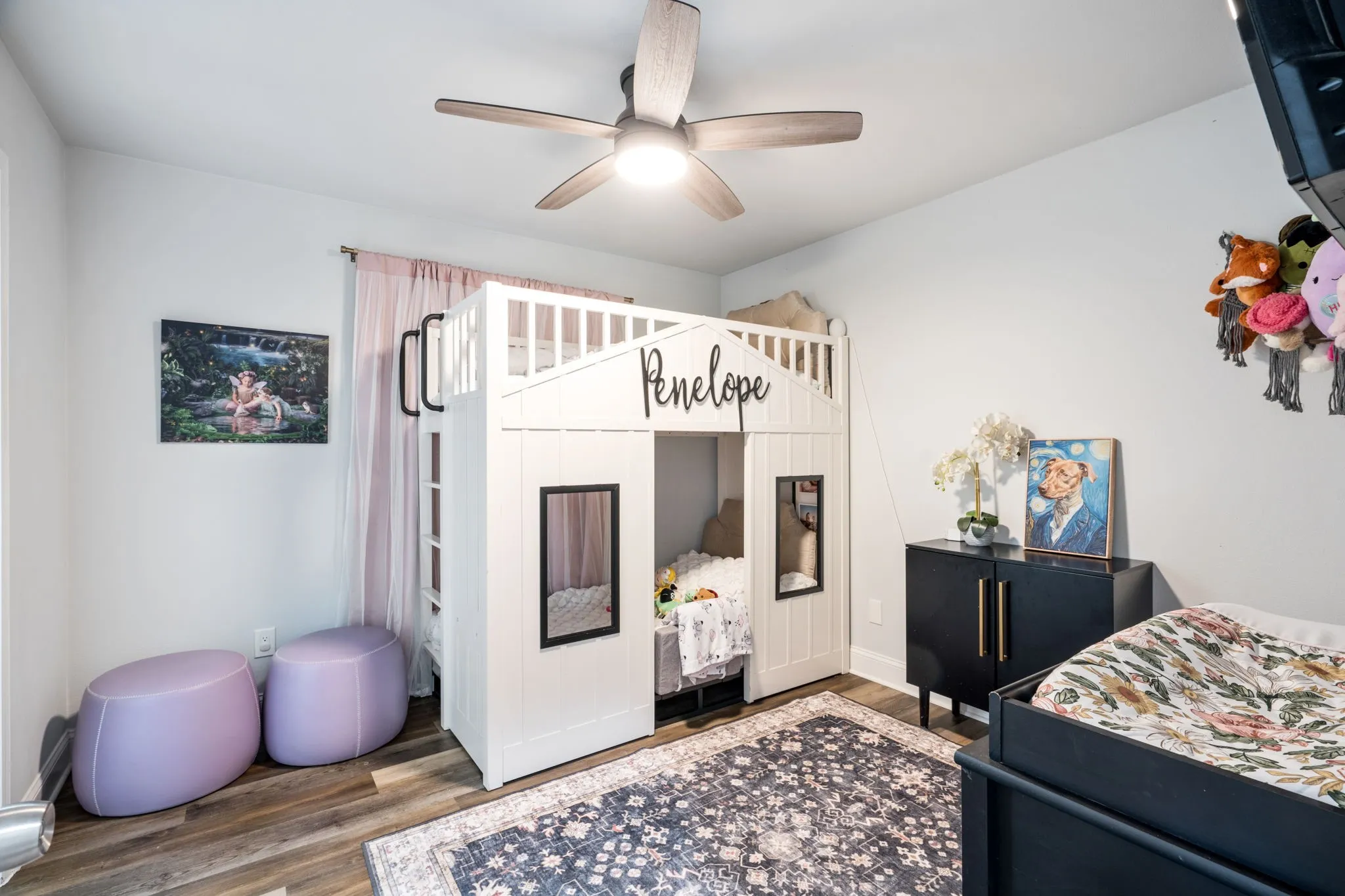 Wood-finish flooring with a ceiling fan overhead