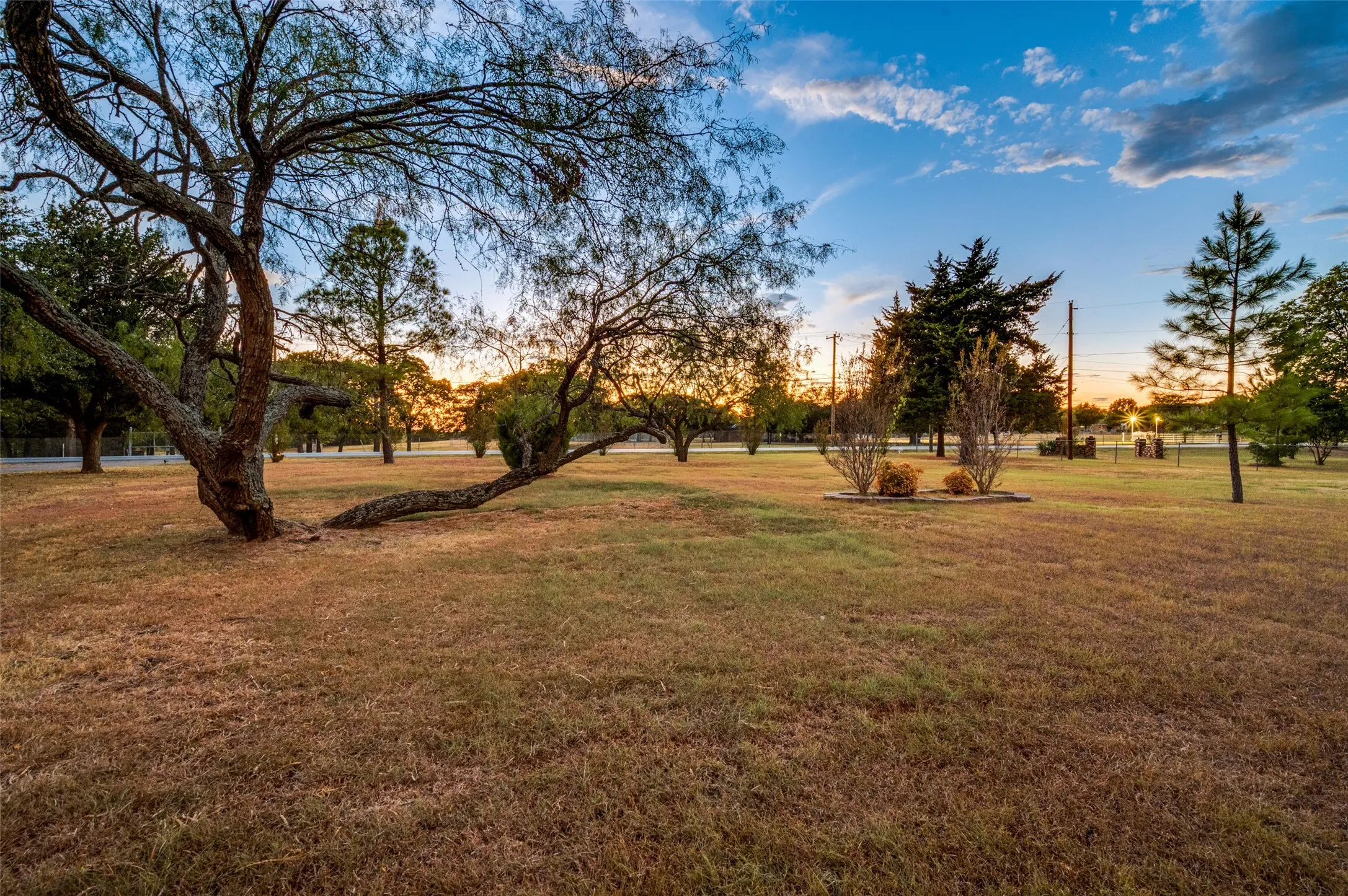 front yard with breathtaking sunset views