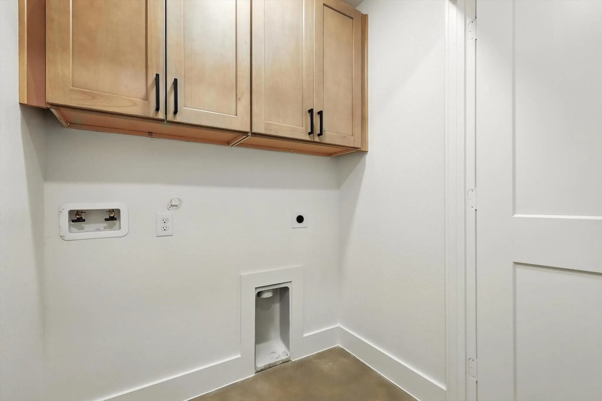 Upper cabinetry with black hardware