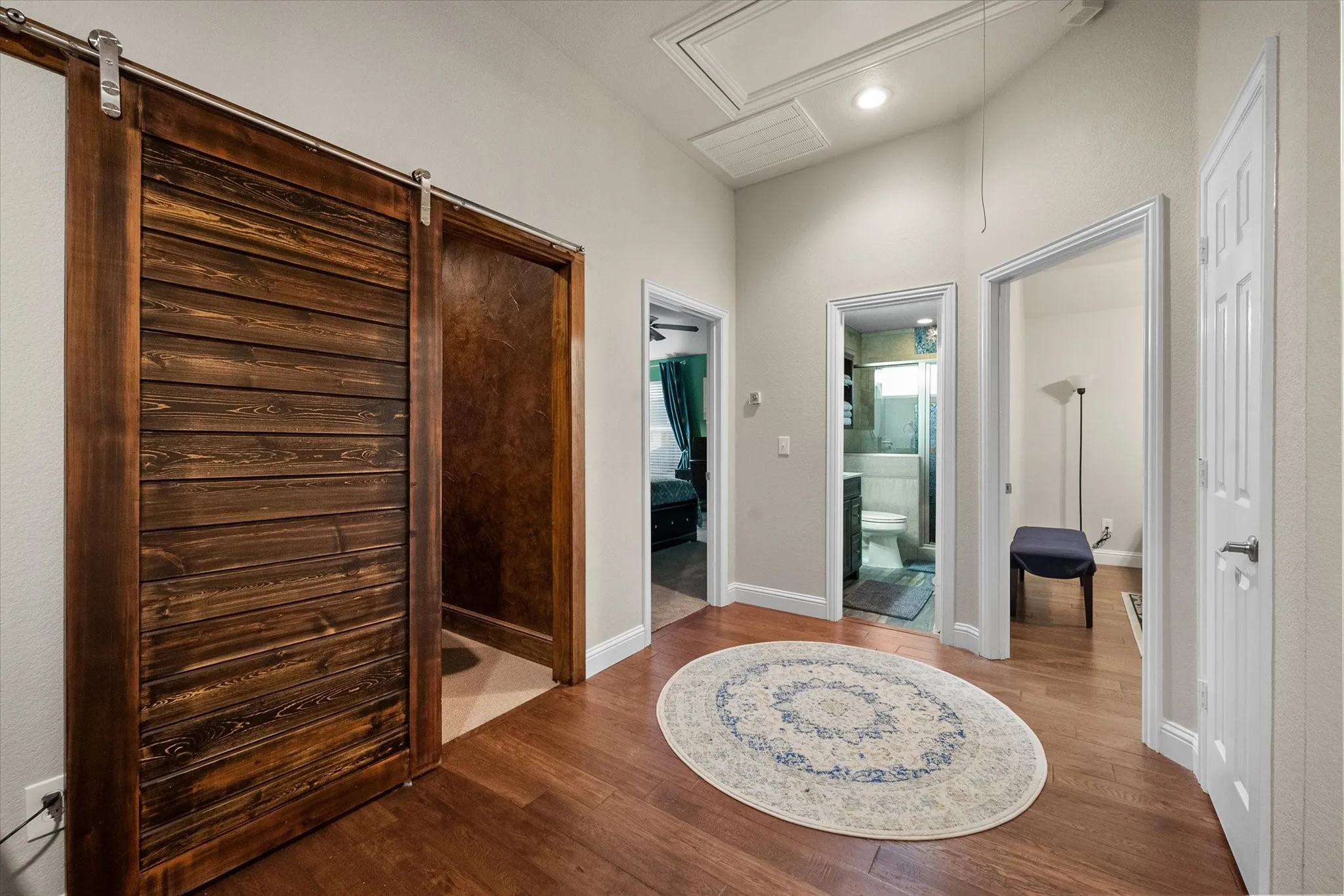 Entry way leading to two additional upstairs bedrooms and full bath