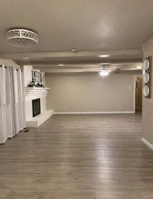 Side view of living room area with no furniture.