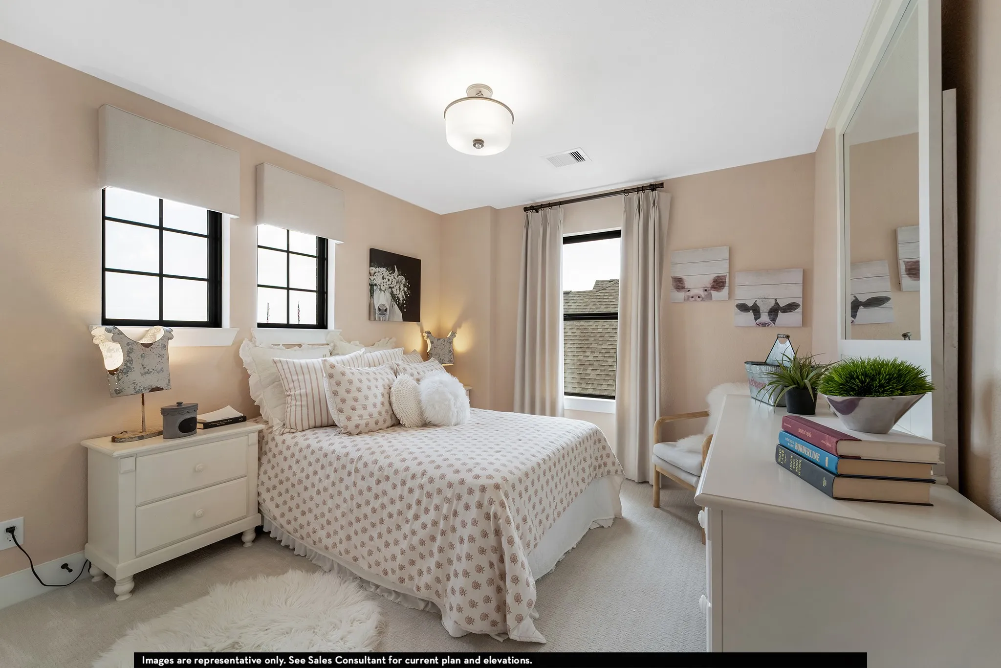 Recessed lighting, wall-mounted light fixture, two windows with black frames, white trim, and light-colored shades, light-colored walls, and carpet flooring