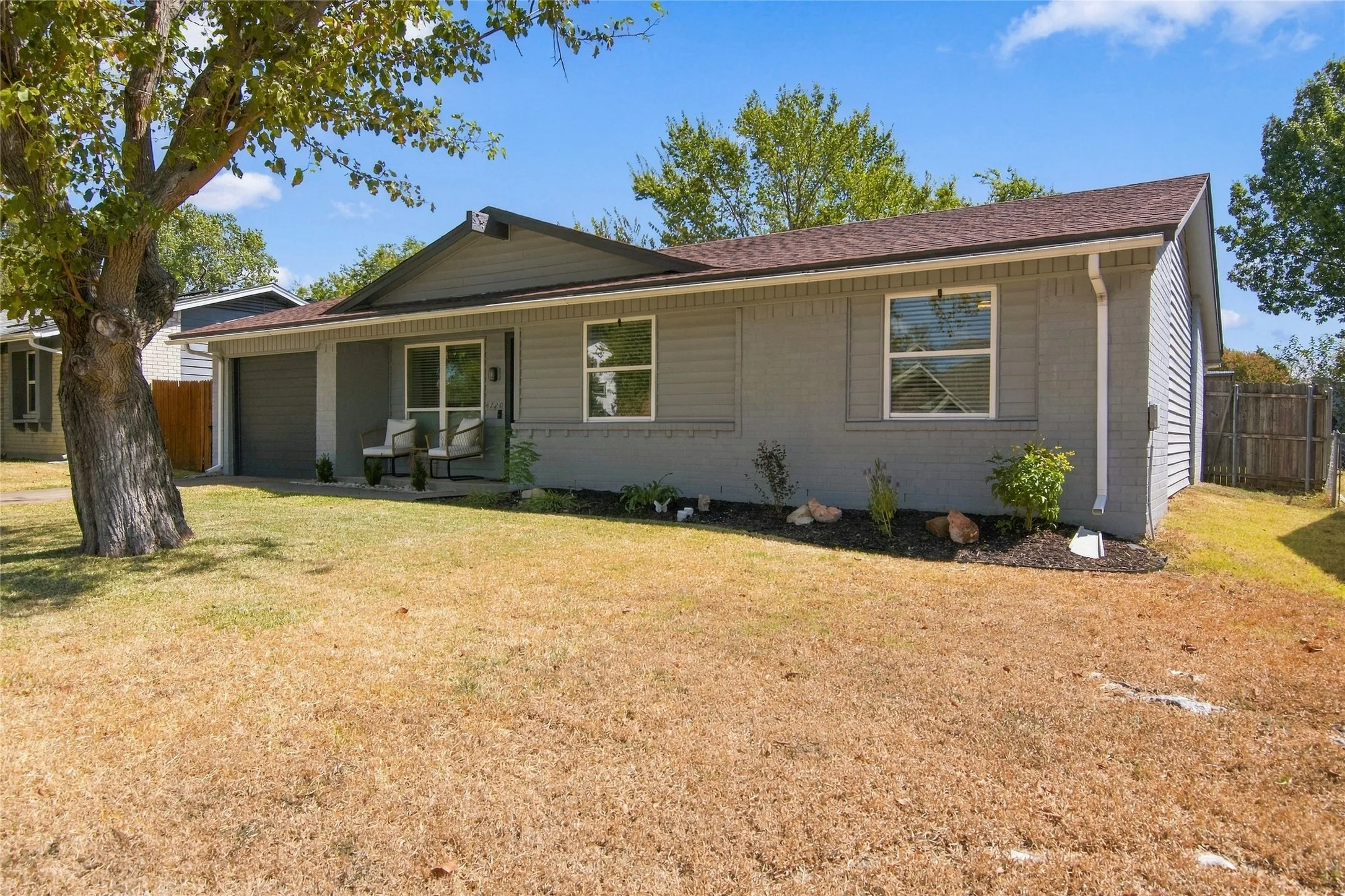Siding exterior with a covered porch entry
