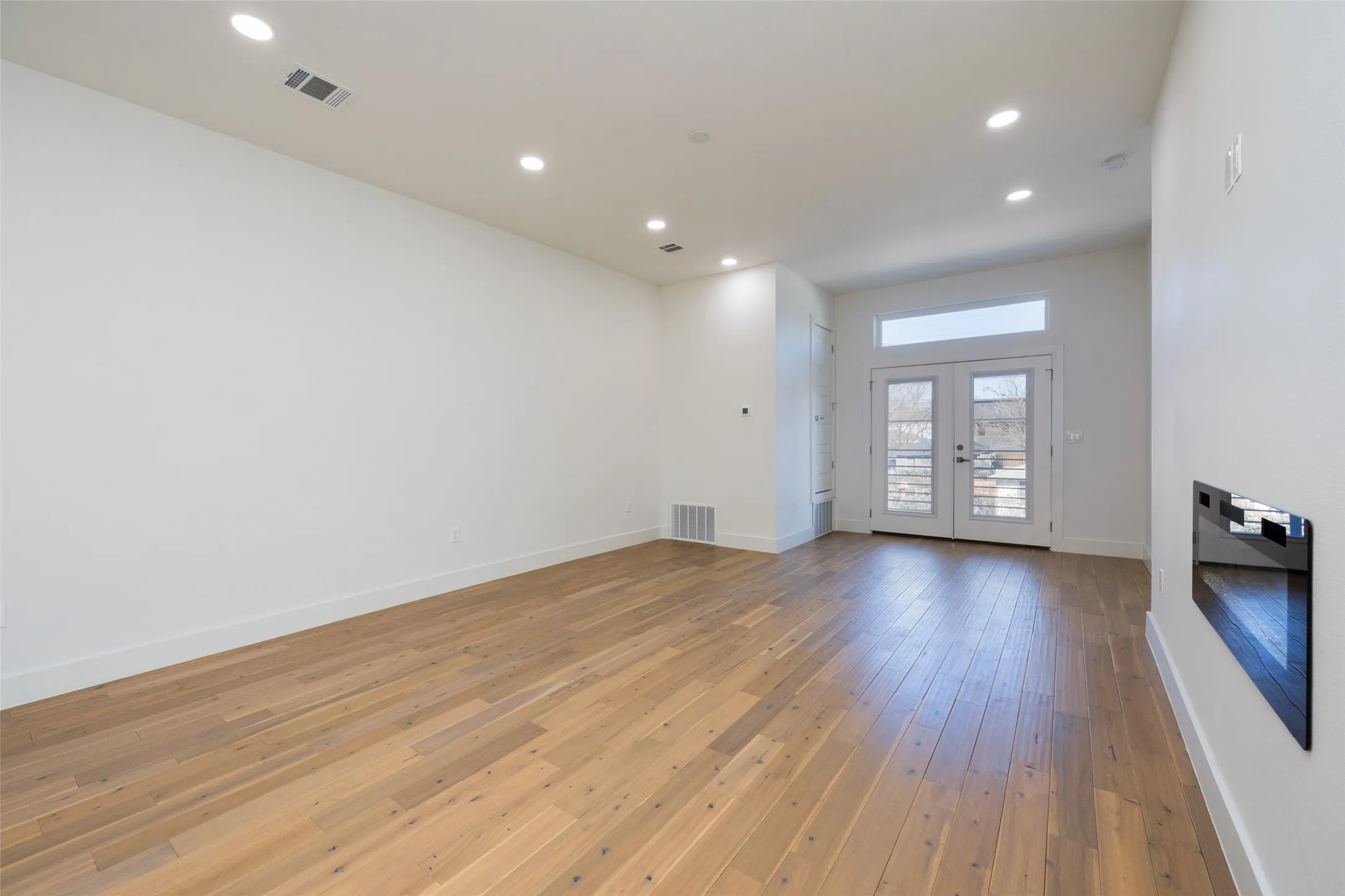 Hardwood-style flooring throughout
