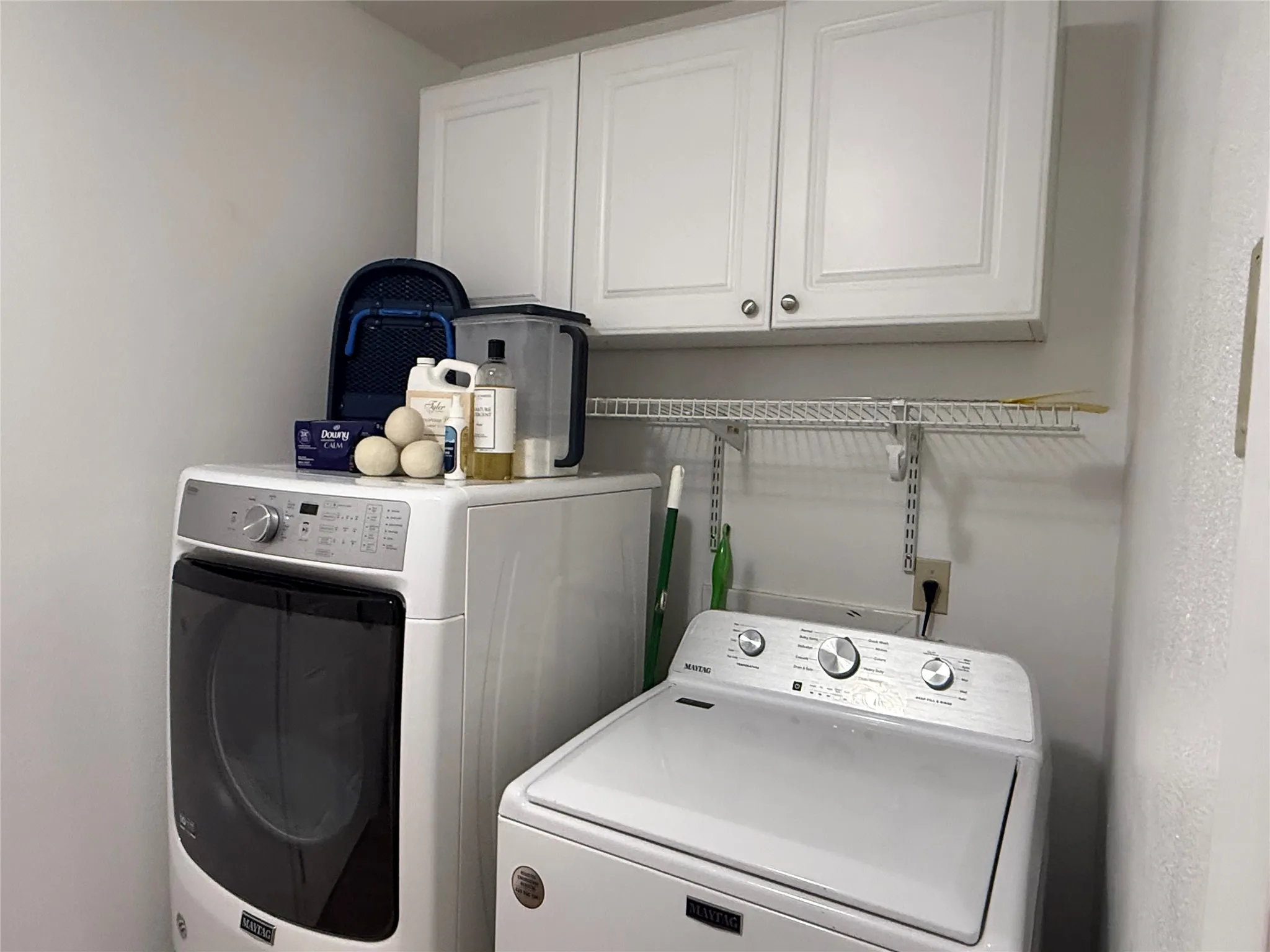 White upper cabinetry with brushed nickel hardware