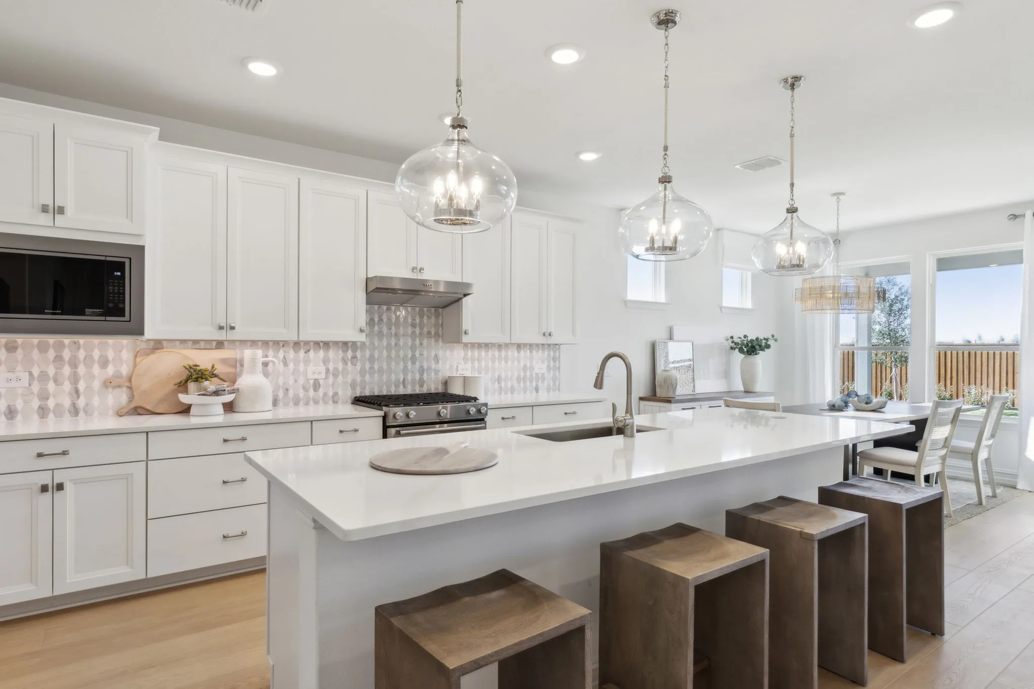 *Model Representation - Large island overlooking gathering room and dining areas