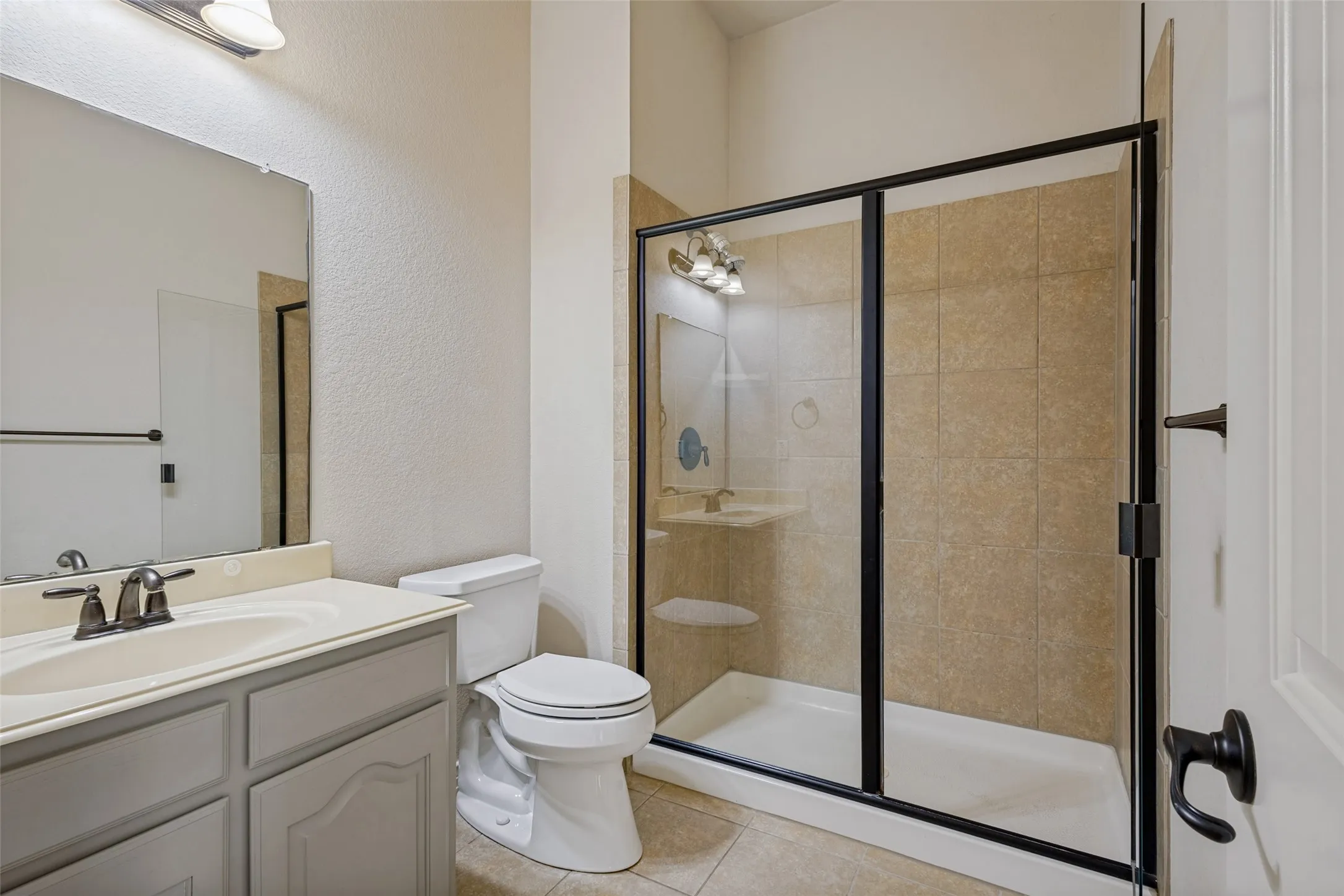 Vanity with integrated sink, bronze-finish faucet, and coordinating hardware