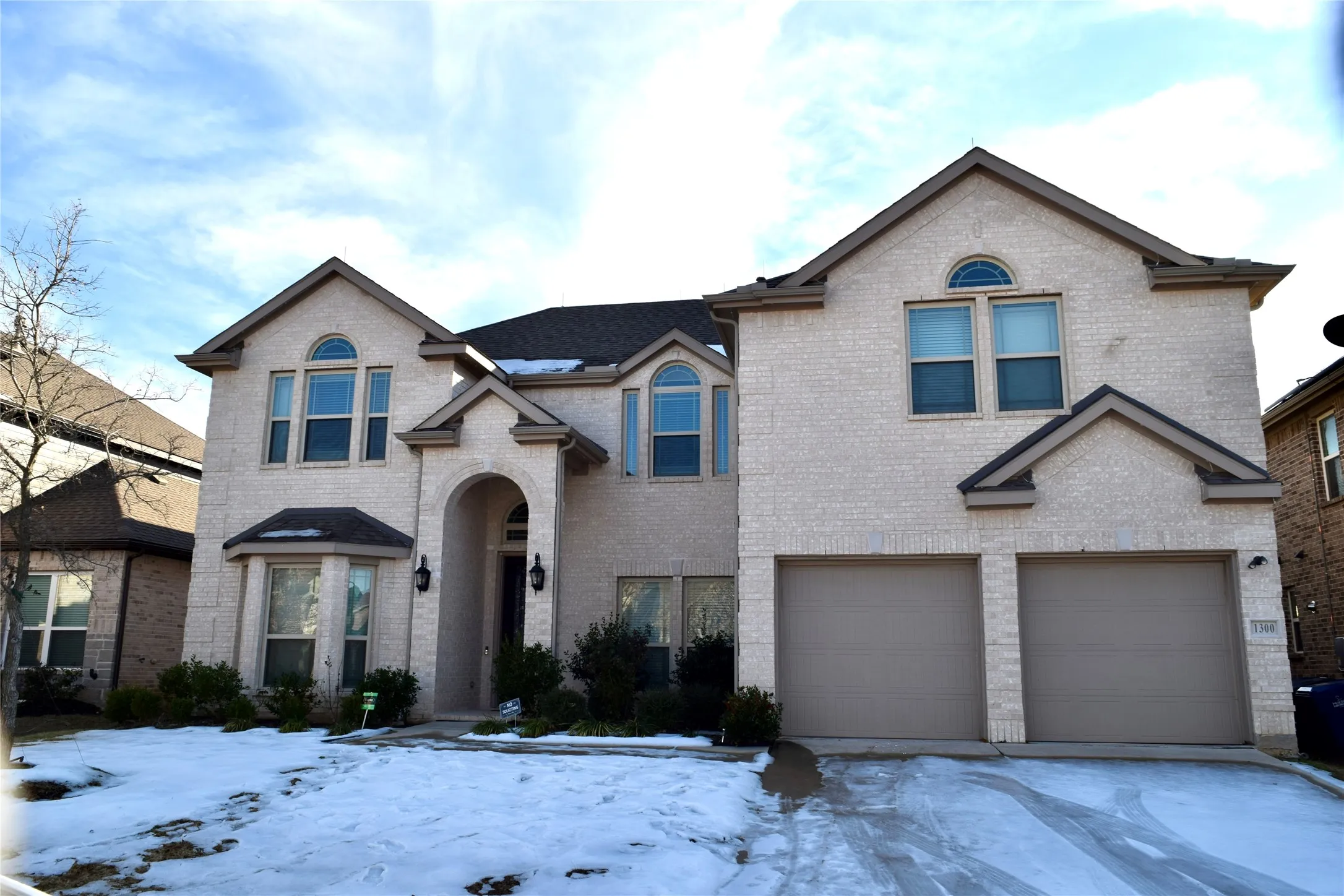 View of front of property featuring a garage
