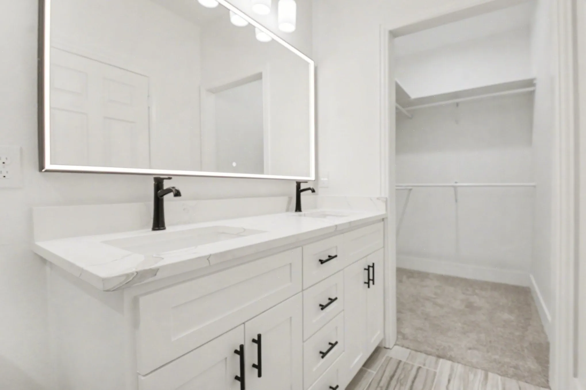 Dual vanity with integrated sinks and matte black fixtures