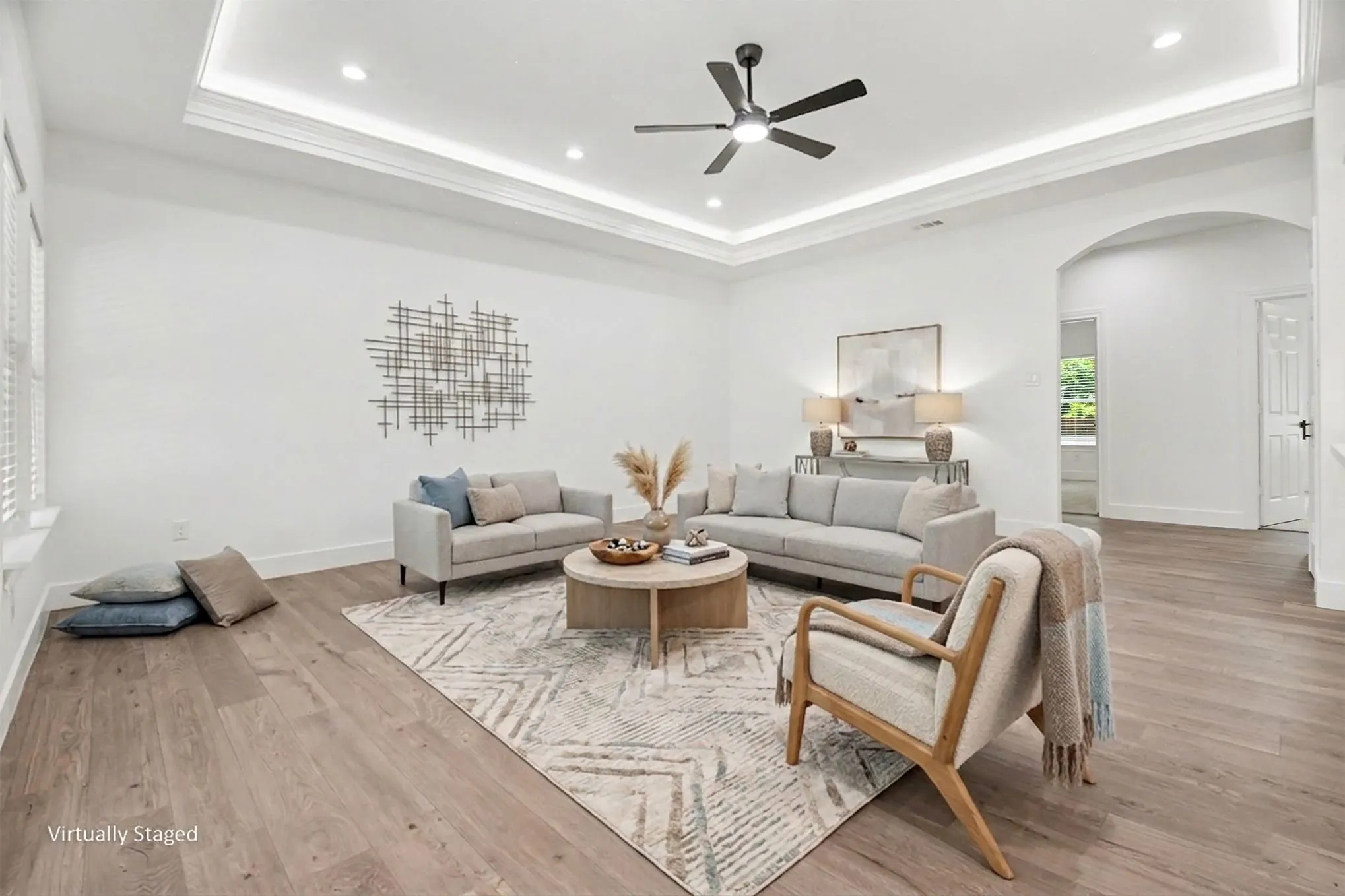 Tray ceiling with recessed lighting and crown molding