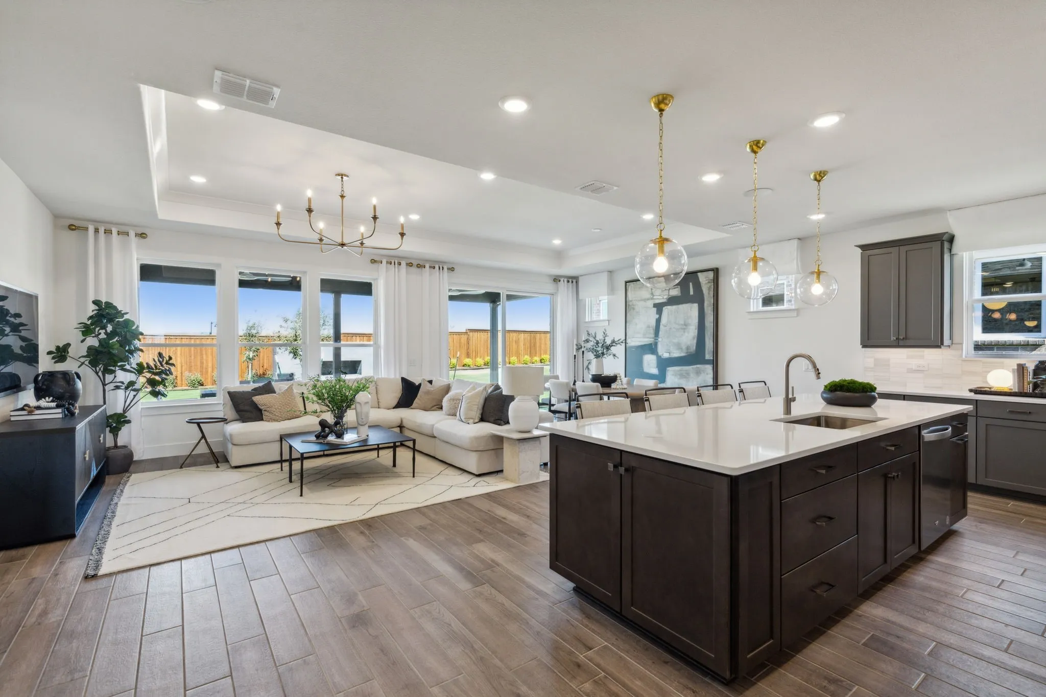 *Model Representation - Large island overlooking gathering room and dining areas