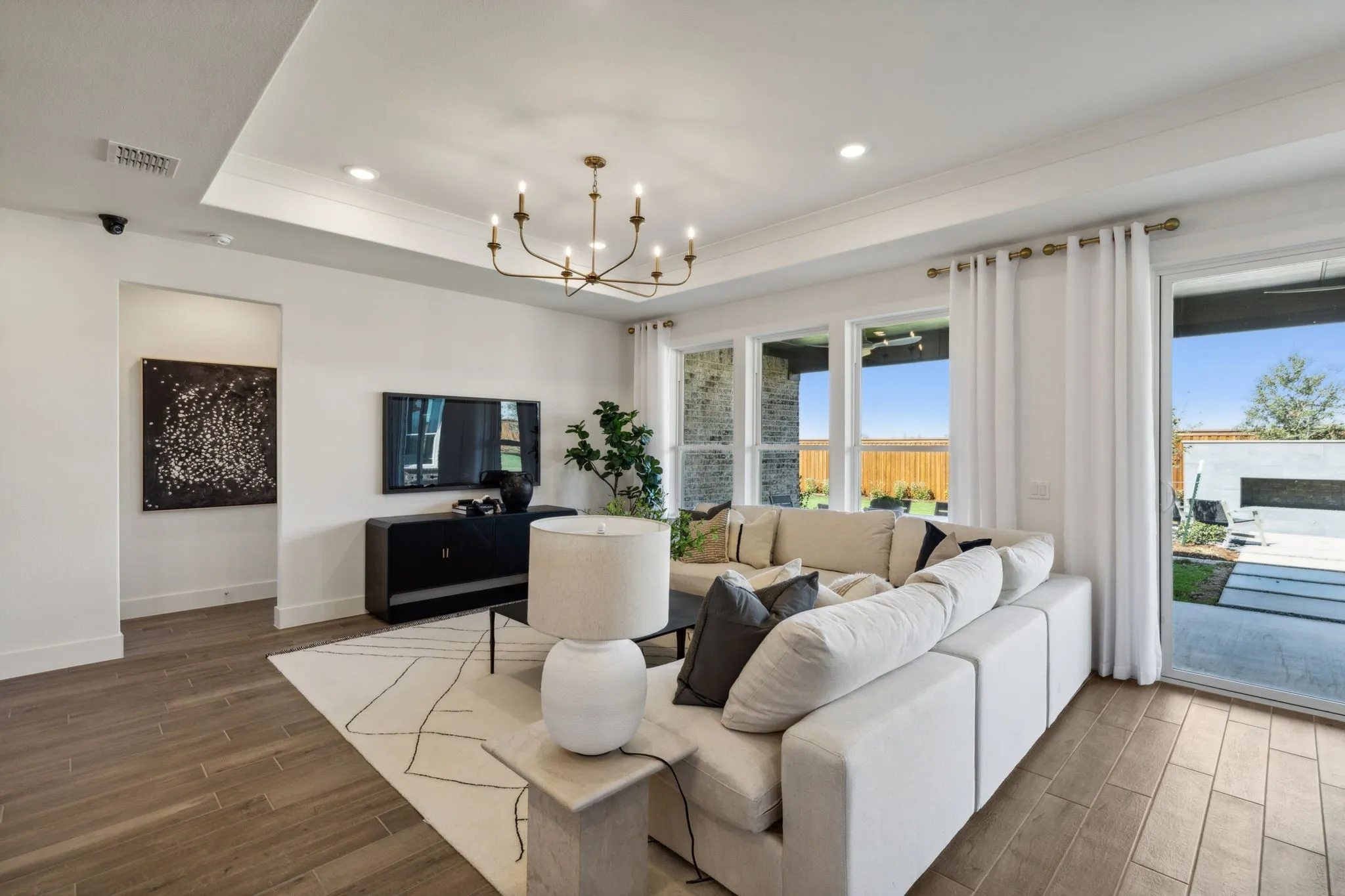 *Model Representation - Spacious gathering room with large windows
