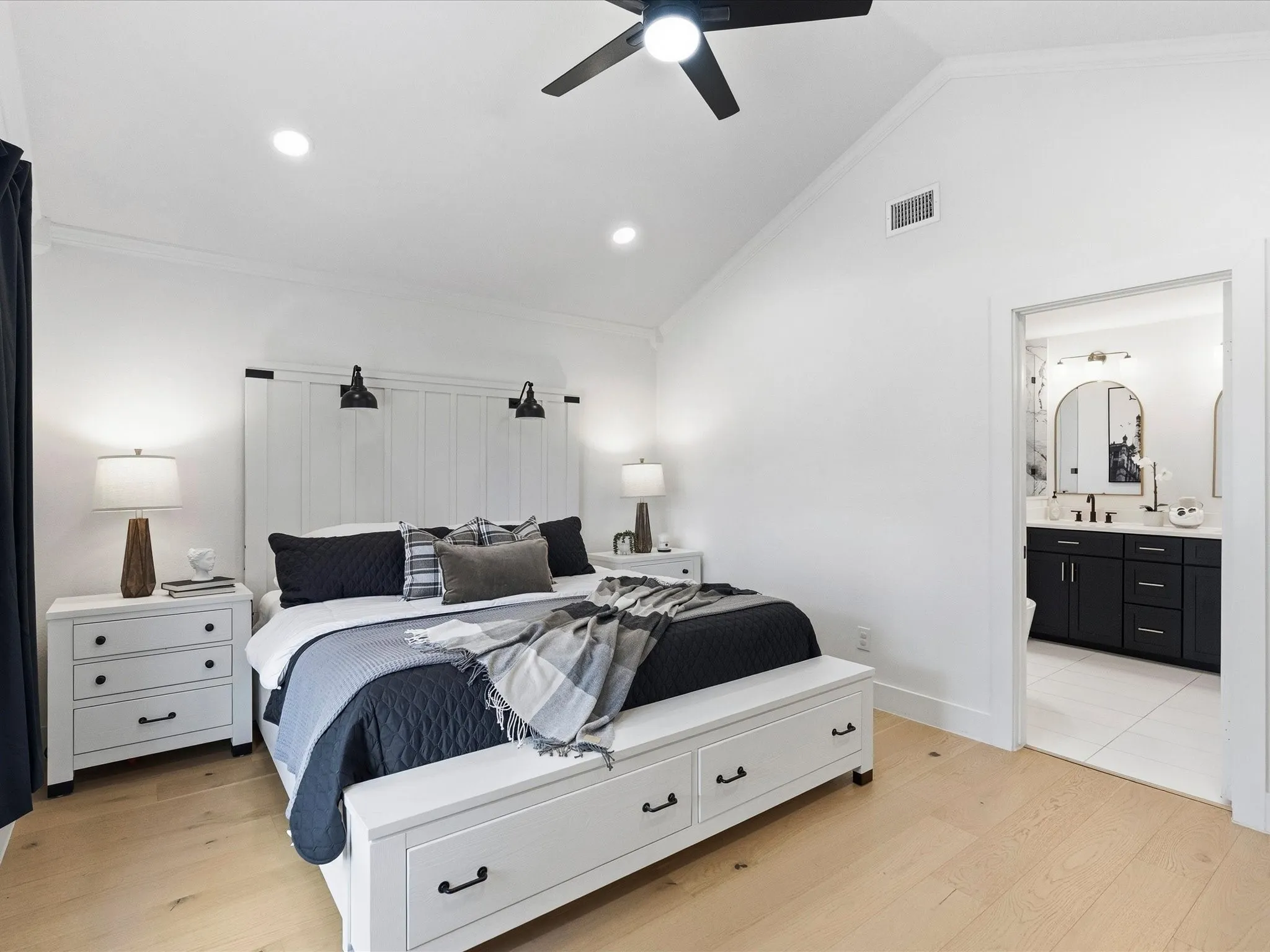 Vaulted ceiling with a ceiling fan and recessed lighting