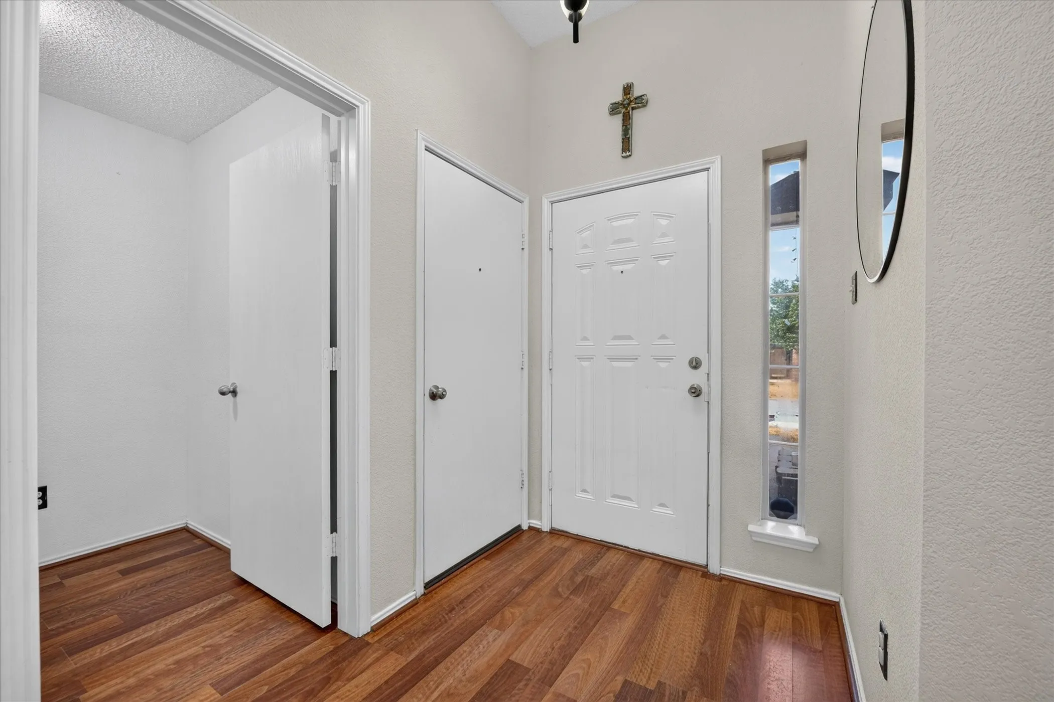 Welcoming foyer featuring bright natural light, clean lines, and direct views into the open-concept main living areas.