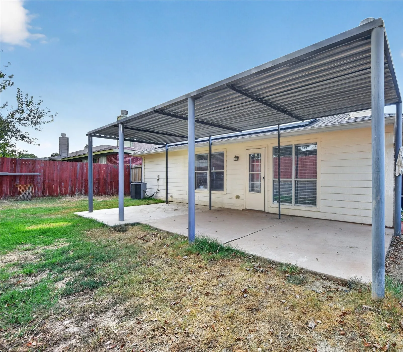 Fully fenced private backyard with a spacious green lawn, offering a safe and peaceful space for outdoor activities, pets, and entertainment.