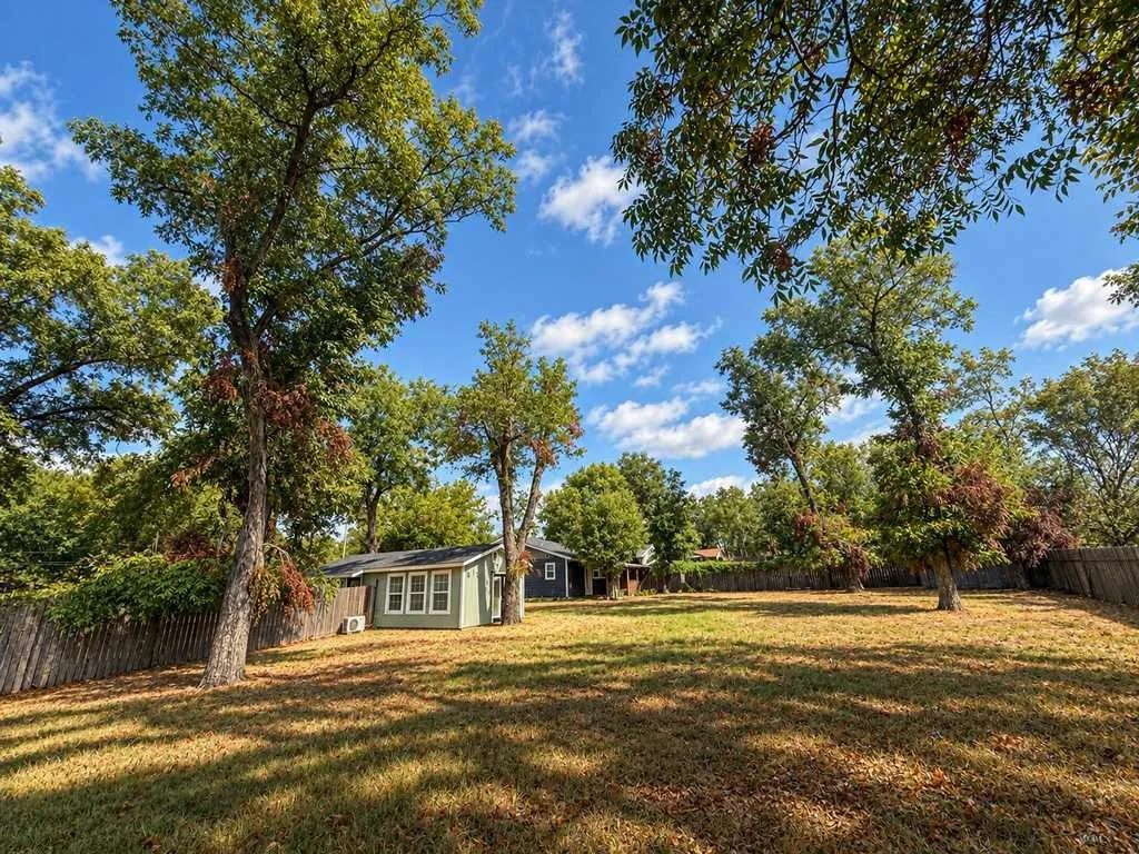 The oversized lot provides uncommon outdoor space for an in-town property.