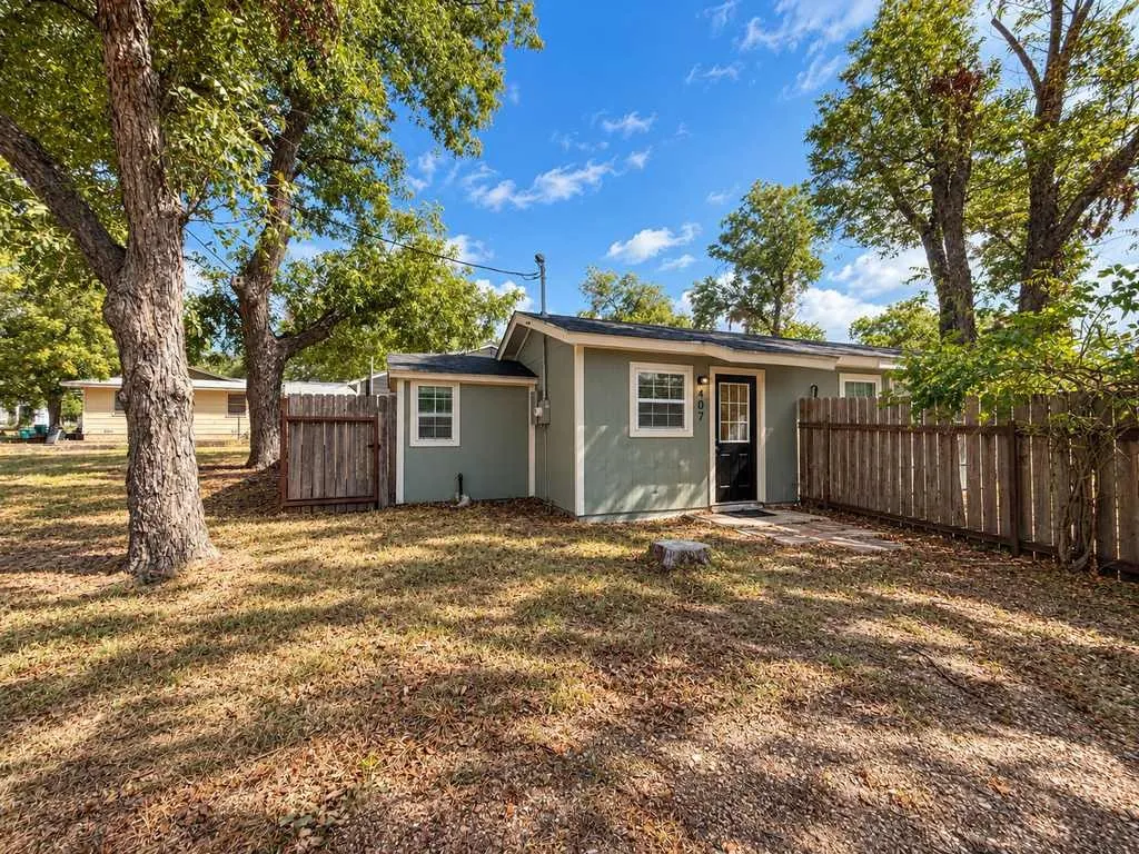Separate cottage with its own entrance, fenced area and mature shade trees.