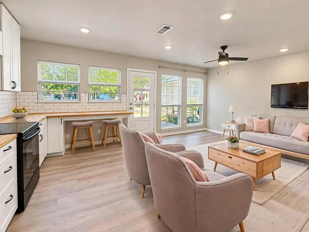 Virtually staged to illustrate the open living and kitchen layout and potential furniture placement.