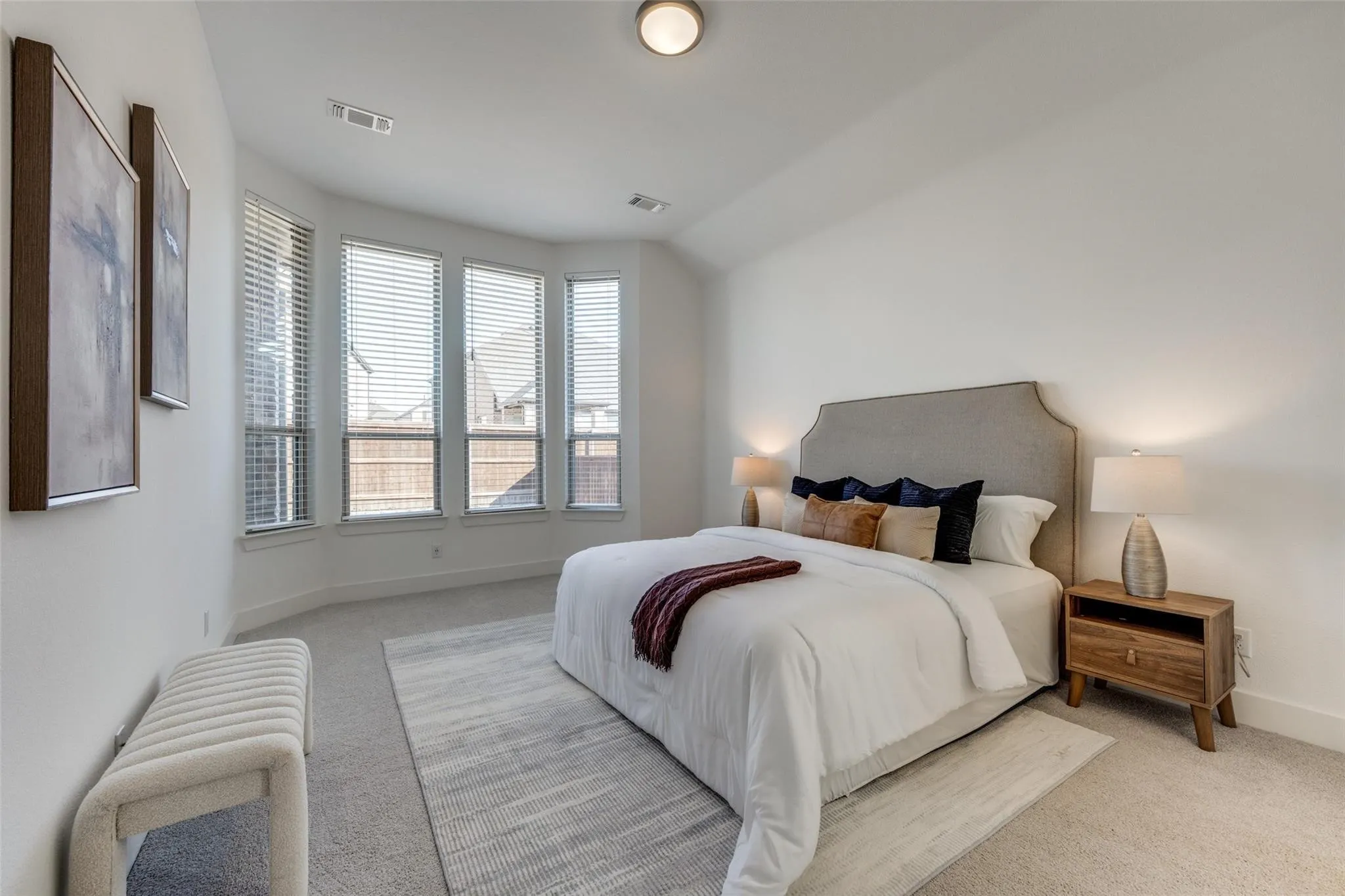 Bedroom with light carpet