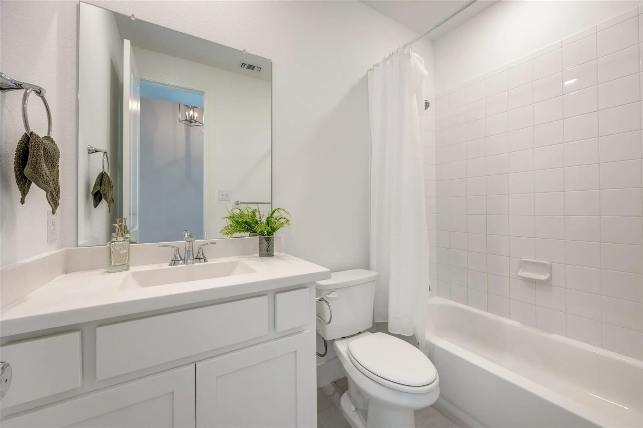Full bathroom featuring vanity and shower / tub combo with curtain
