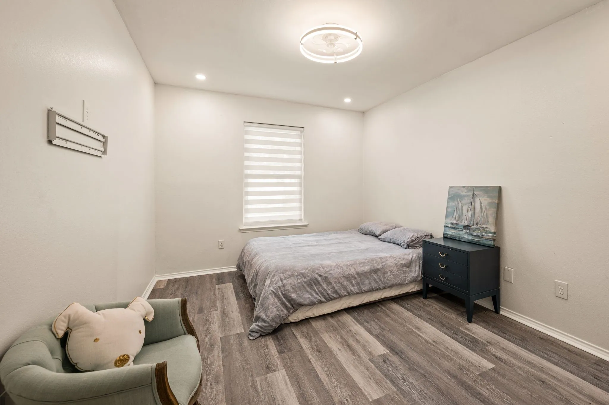 Recessed ceiling lighting, wood-finish flooring, window with blinds, and flush-mount ceiling light