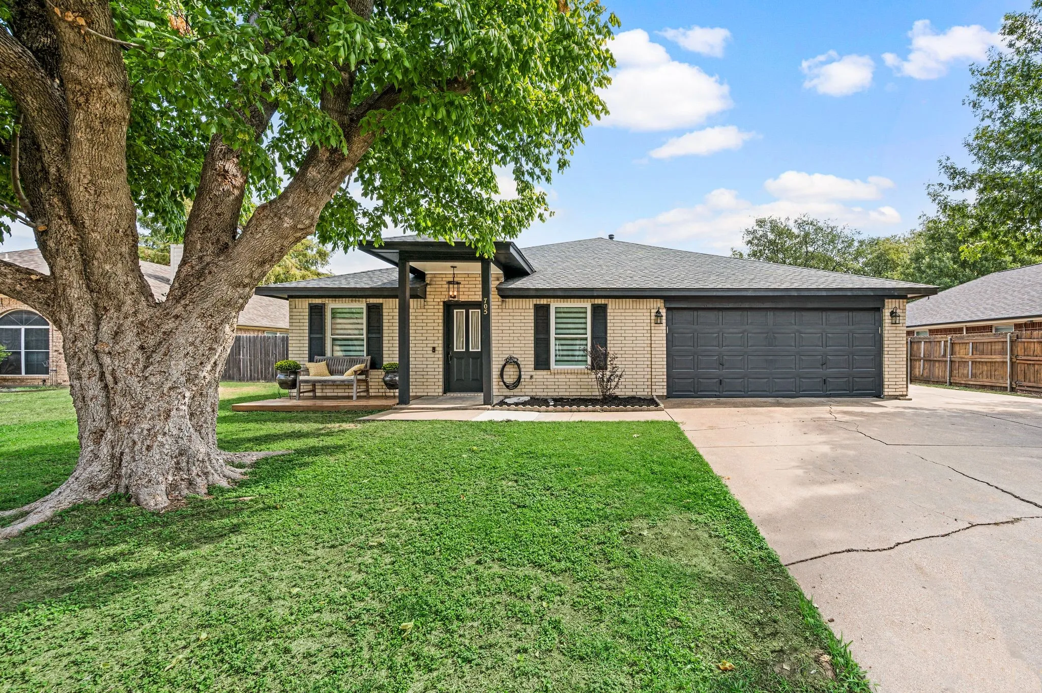 Light brick exterior with dark trim accents