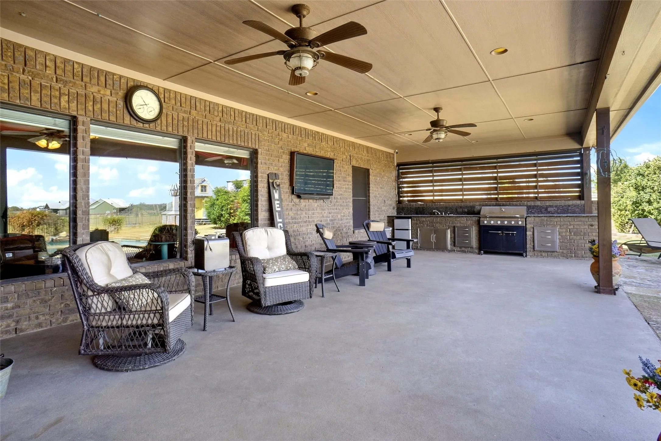 2 ceiling fans, grill, sink, mini refrigerator.  Lounge chairs by pool will stay with the property.
