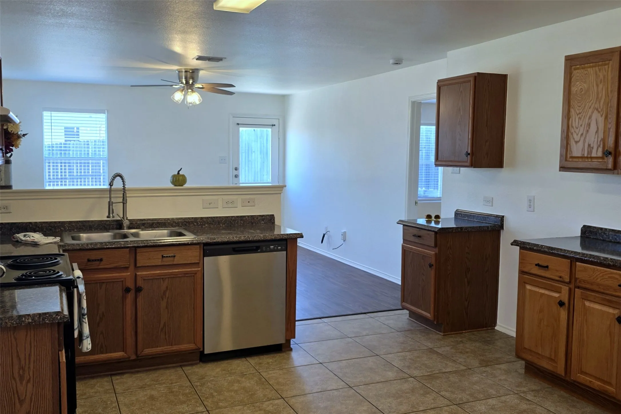 Kitchen is complete with an electric range, dishwasher and disposal.