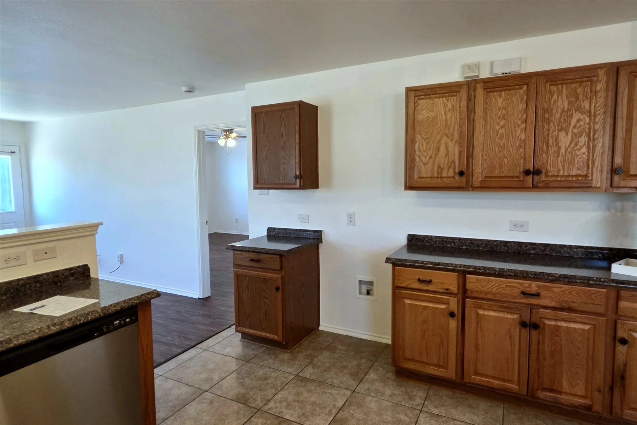 Kitchen has tile floors and plenty of storage!