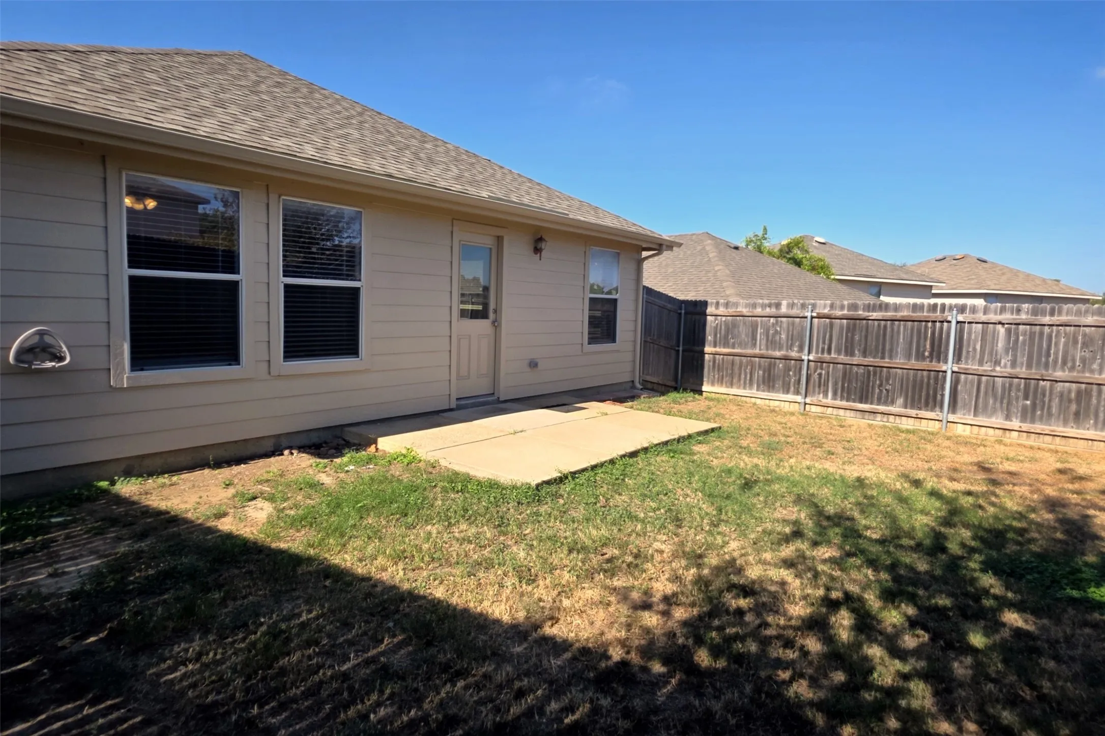Grassy backyard is low maintenance.