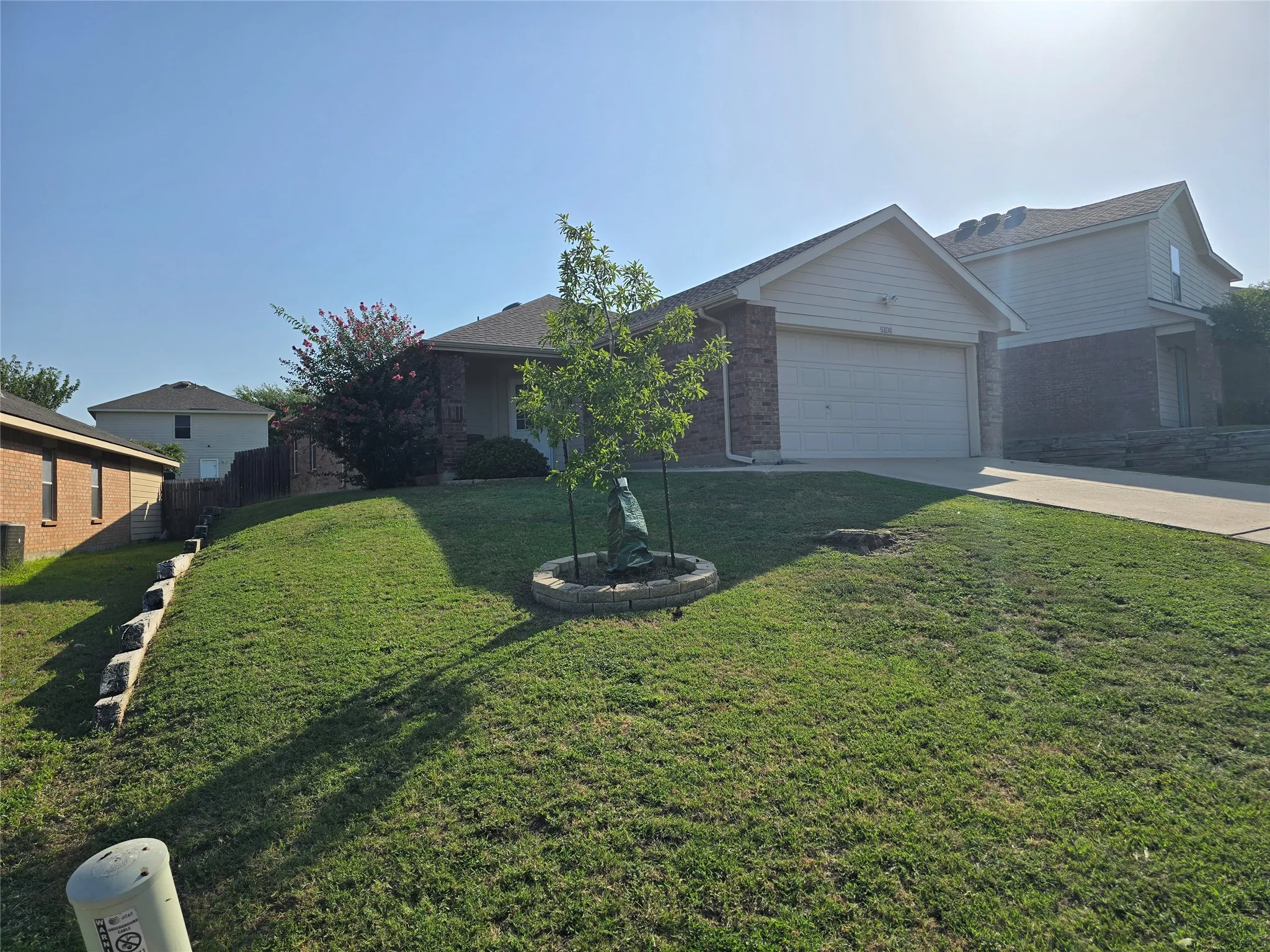 Well-maintained front yard earlier this year, ready for its next green thumb.