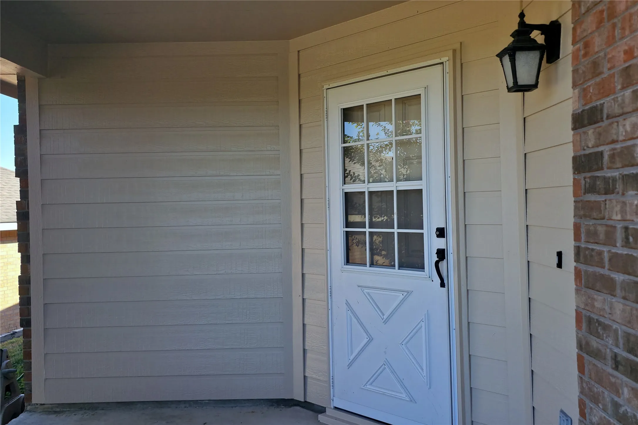 Enjoy the view from this covered front porch, with room for your own outdoor seating!