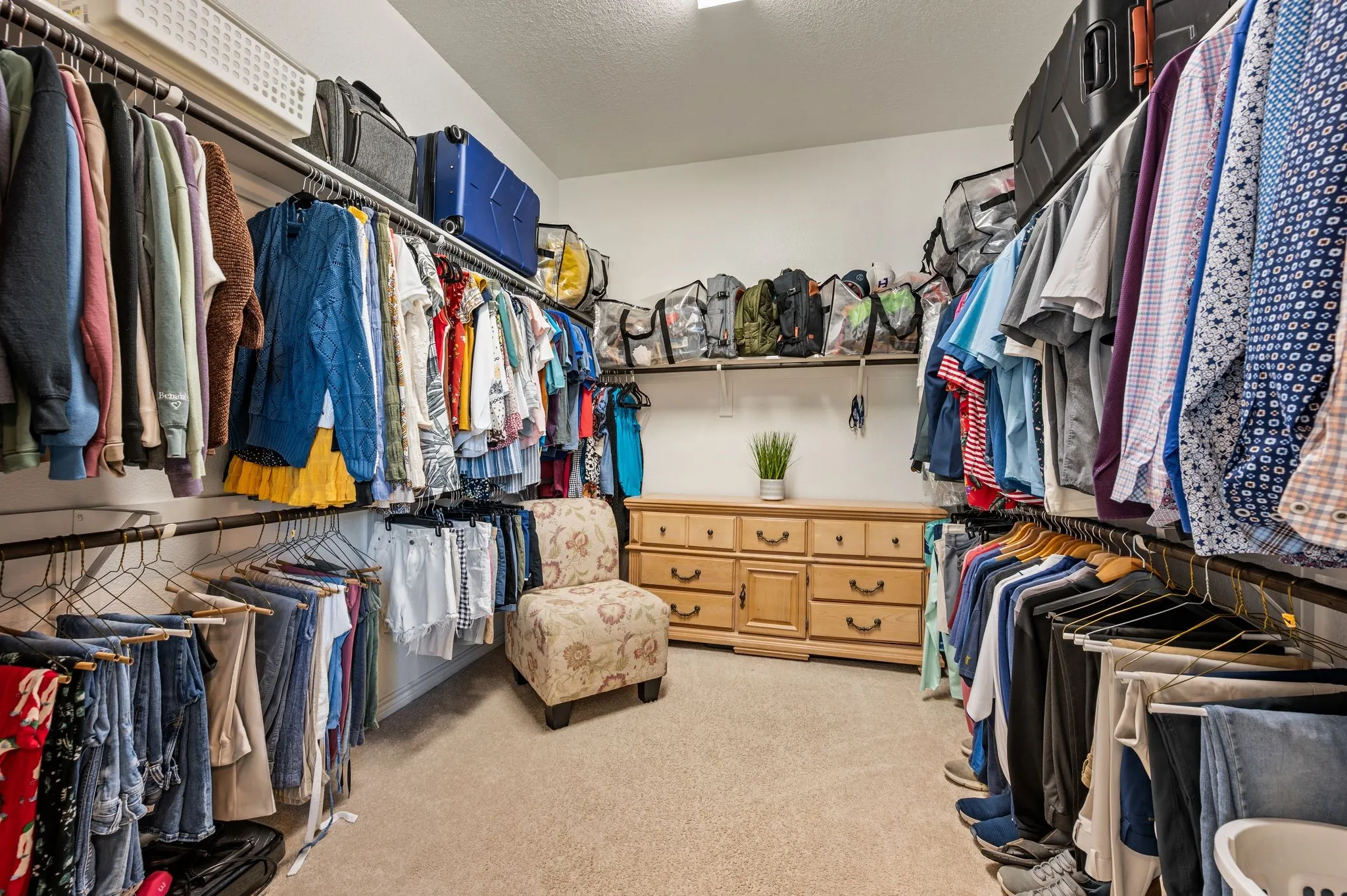 The over sized primary closet will give you so much room for all your clothes plus some.  As you can see there is a large dresser in here.  The sellers had the primary closet built a tad bit bigger when the built their home.