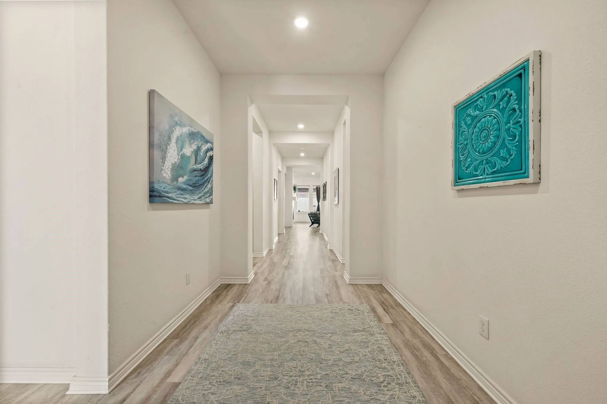 large open and wonderfully lighted foyer featuring LVP flooring, recessed lighting, and crisp white walls!  You will Love welcoming your friends and family to your new home!