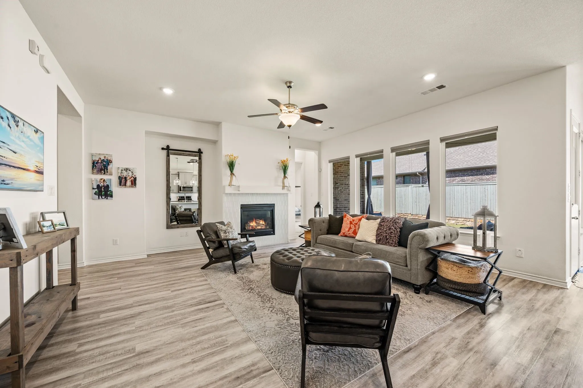 Open and bright living space with a beautiful fireplace with gorgeous tile around it and so much space to entertain your family & friends.