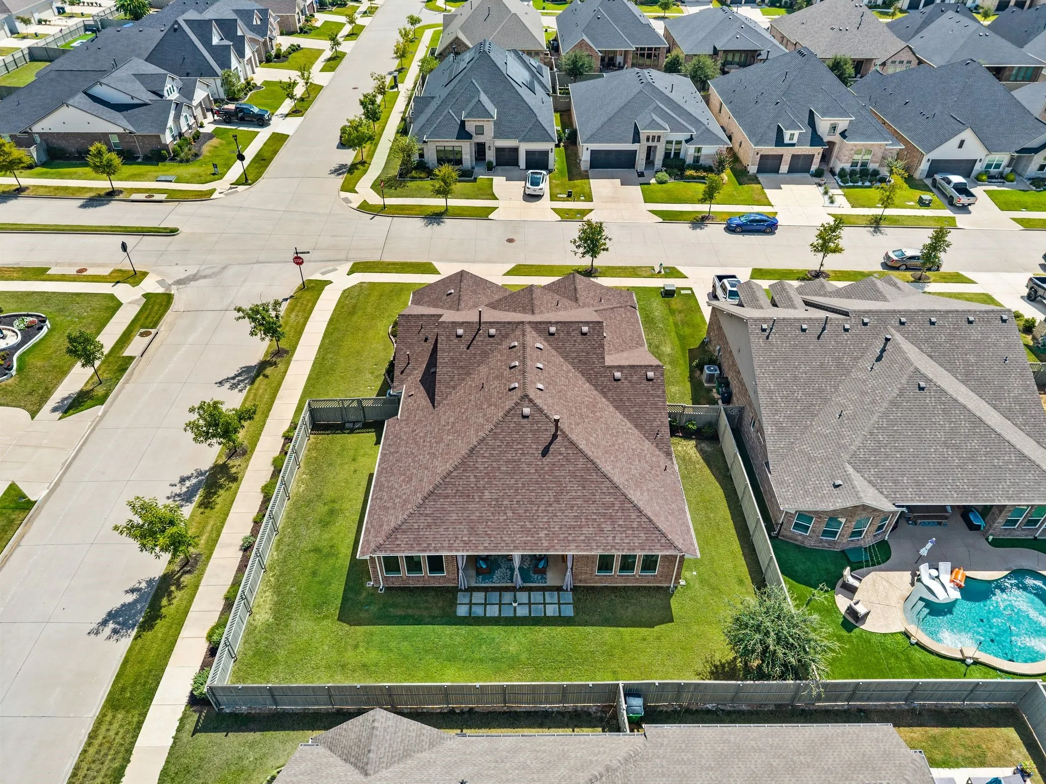 Expansive fenced backyard with a manicured lawn...What a beautiful place to call home!