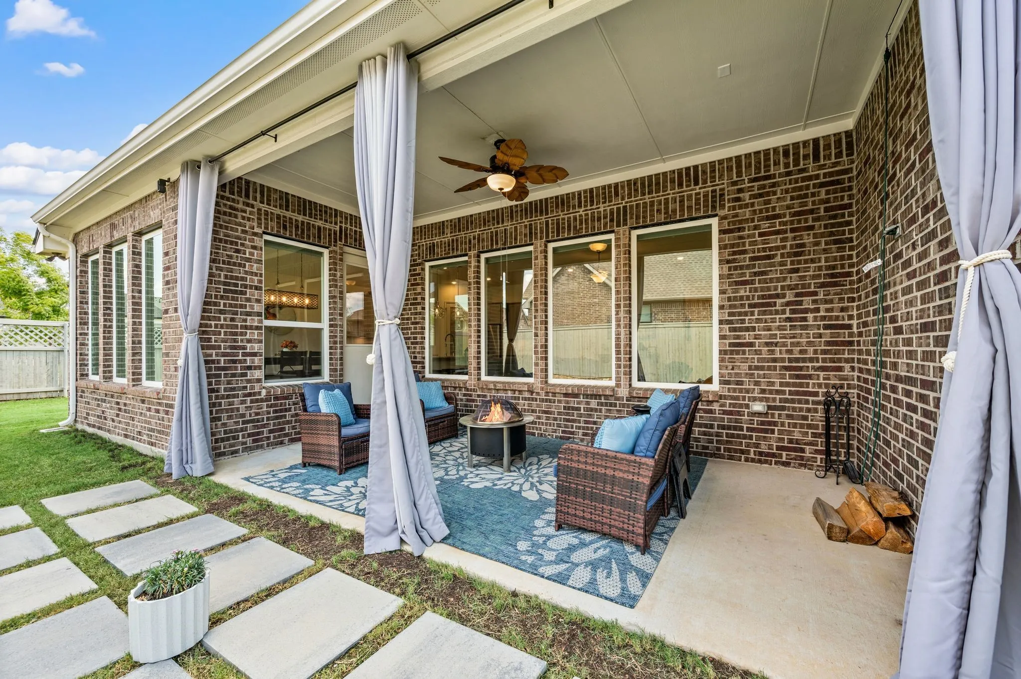 Covered patio with a wonderful ceiling and a large space for furniture and to grill if you desire.  This space is shaded 24-7 so you truly can sit outside and enjoy the patio even during the summer days!